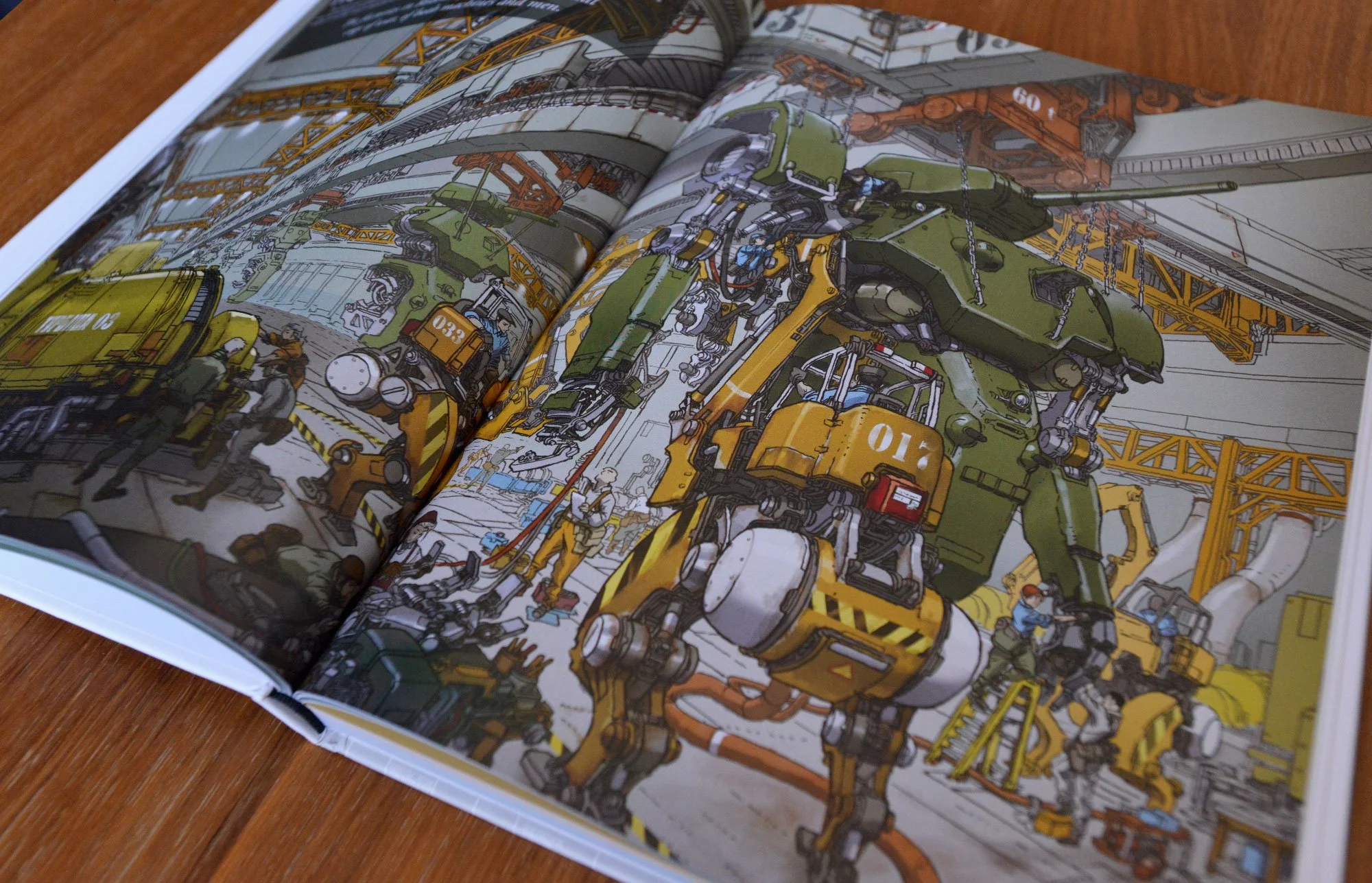 Colorful industrial illustration of robots, construction vehicles, and workers inside a manufacturing facility with cranes and pipes.