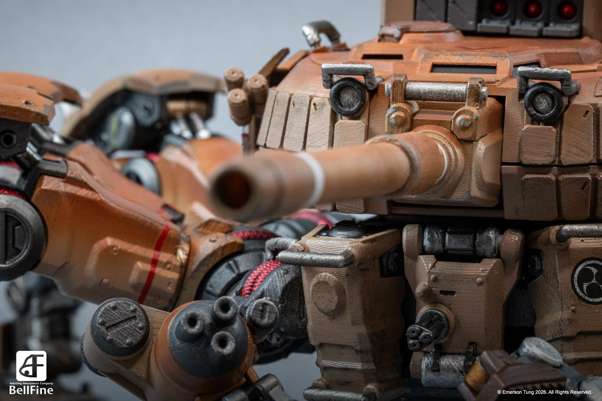 Close-up of a detailed plastic model of the Type 33 Heikegani crab tankhead, from Emerson Tung's TANKHEAD IP. It's a tan-colored, robotic crab with multiple legs and mechanical components, on a gray surface.