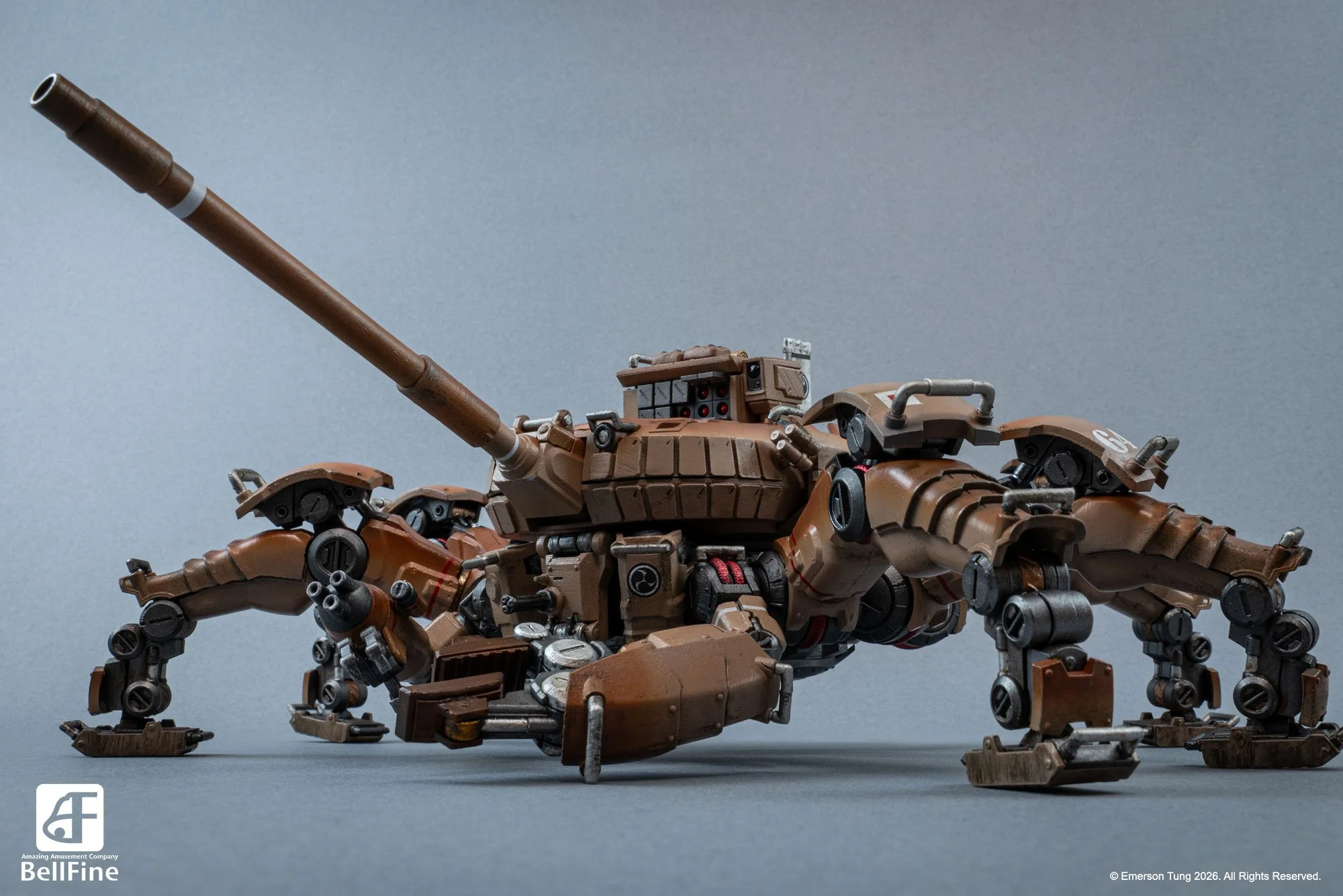 A detailed plastic model of the Type 33 Heikegani crab tankhead, from Emerson Tung's TANKHEAD IP. It's a tan-colored, robotic crab with multiple legs and mechanical components, on a gray surface.