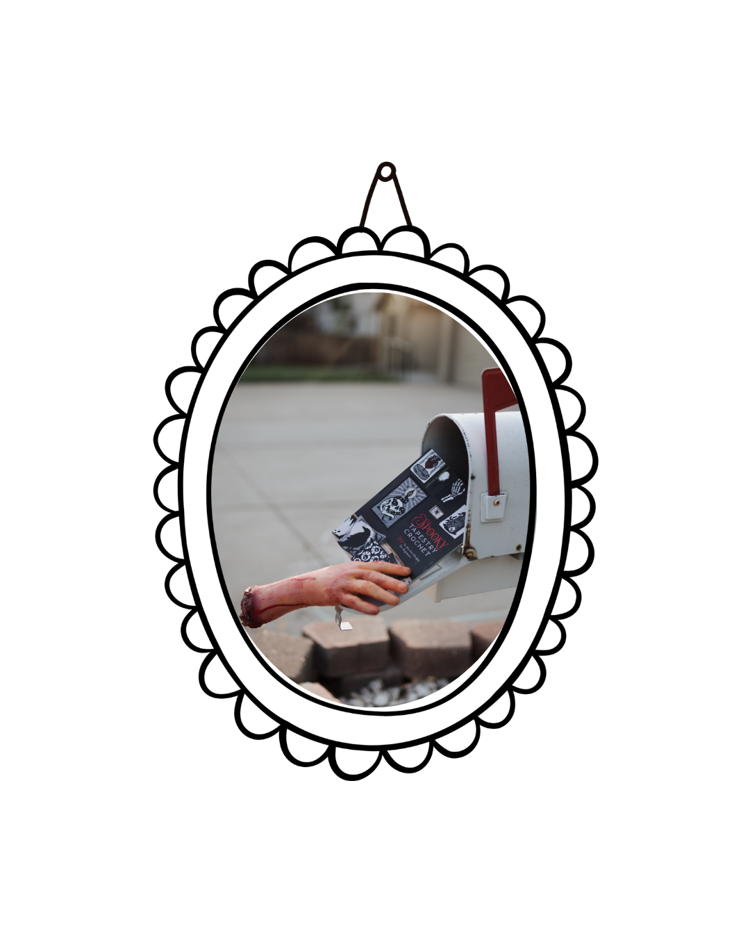 A person's hand with a bloody and wounded arm reaching into a mailbox, pulling out a black and white book