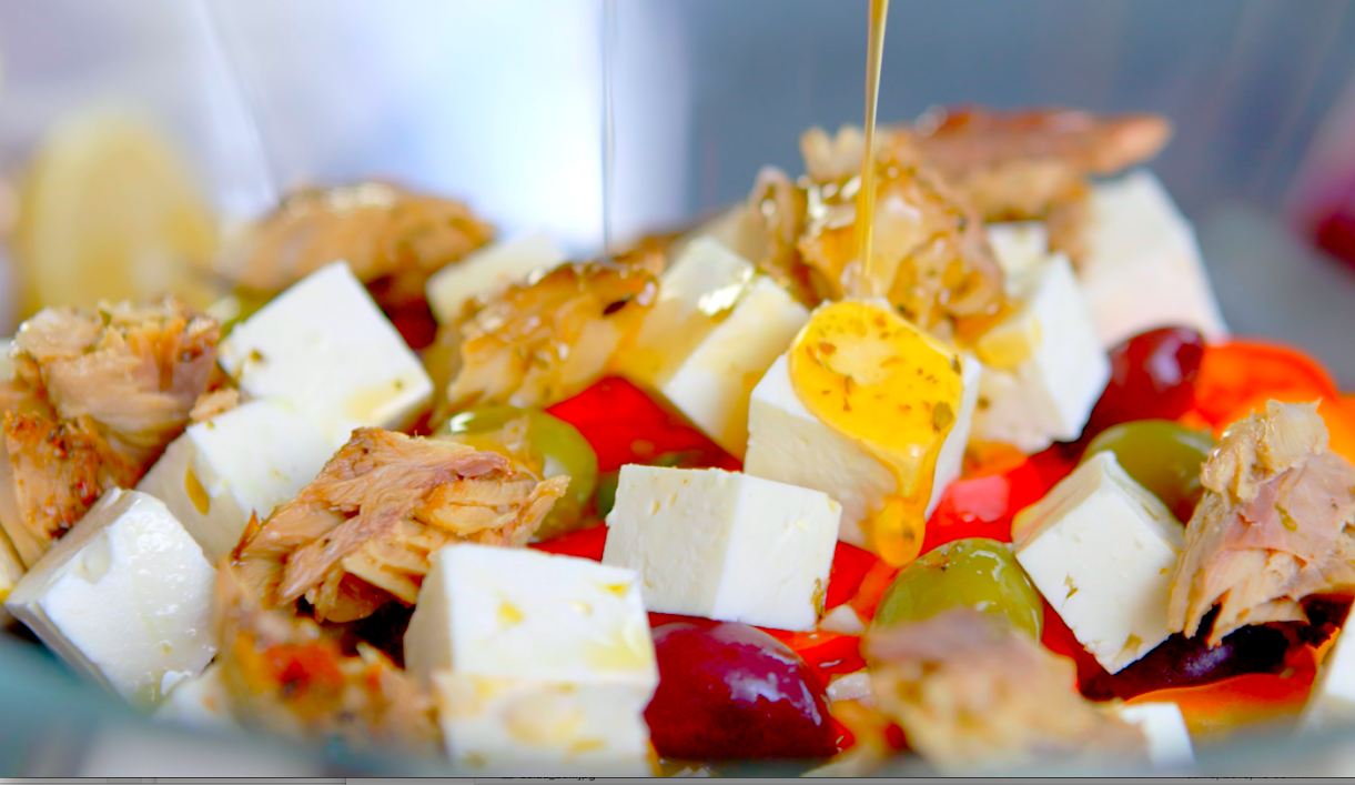 Feta cheese cubes, shredded cooked chicken, green and red grapes, pouring honey or syrup