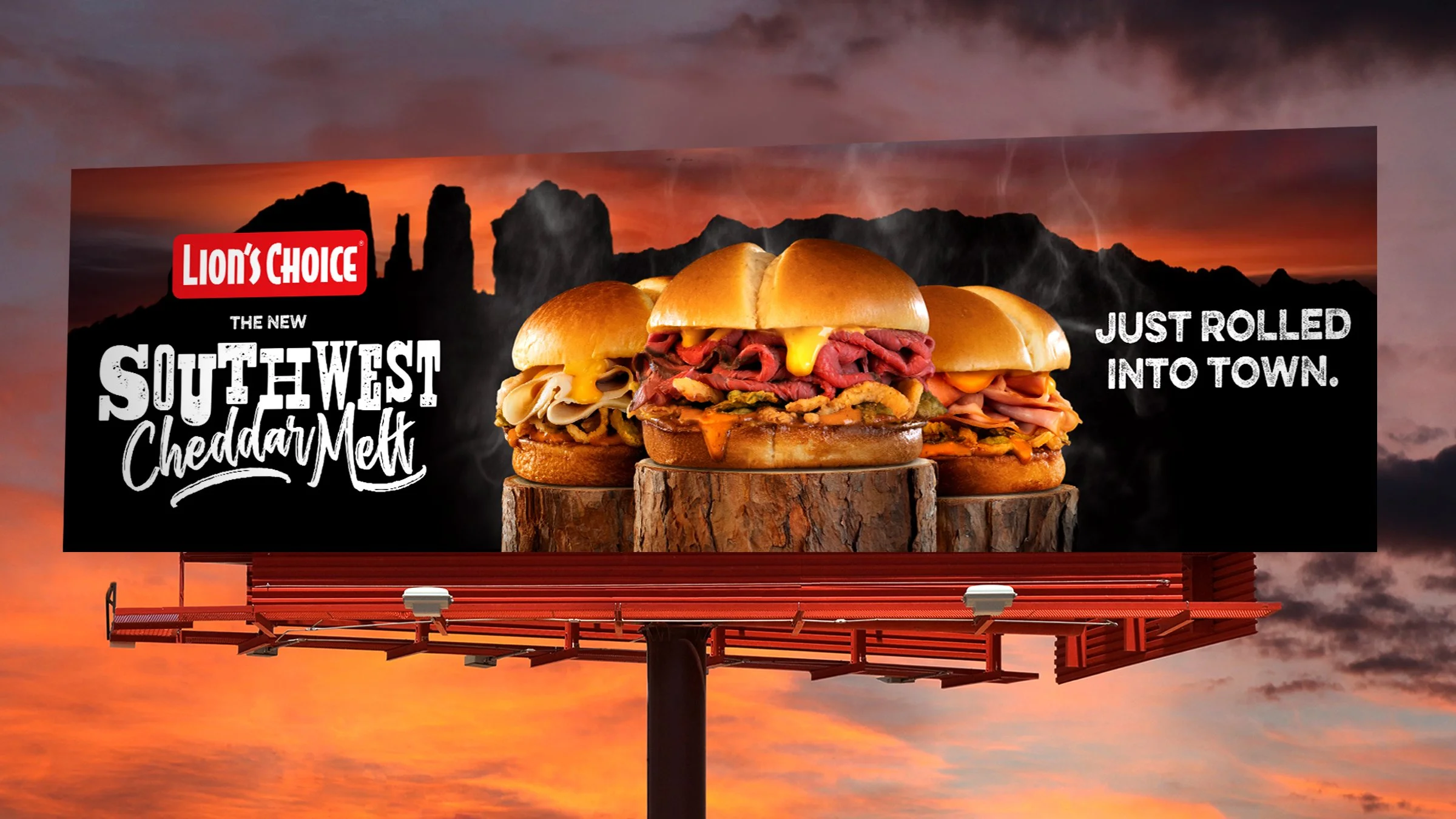 Billboard advertisement for Southwest Cheddar Melt sandwiches featuring three specialty sandwiches with melted cheese, roast beef, and other ingredients, set against a sunset landscape with mountainous background.