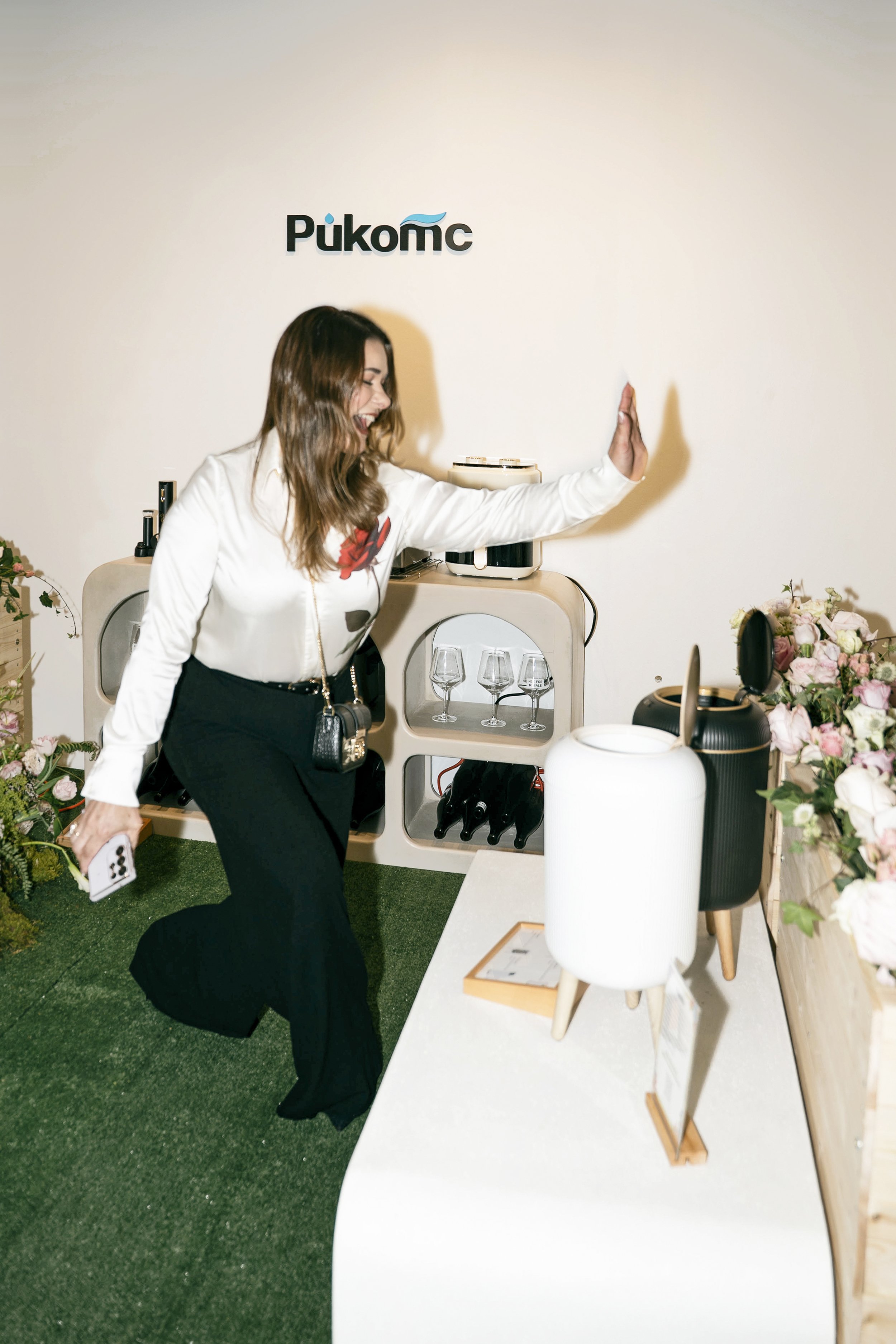 A VIP guest experimenting with the sensor trash bin from Pukomc at TikTok Super Wish Season pop-up event by experiential production agency ANG Concept.