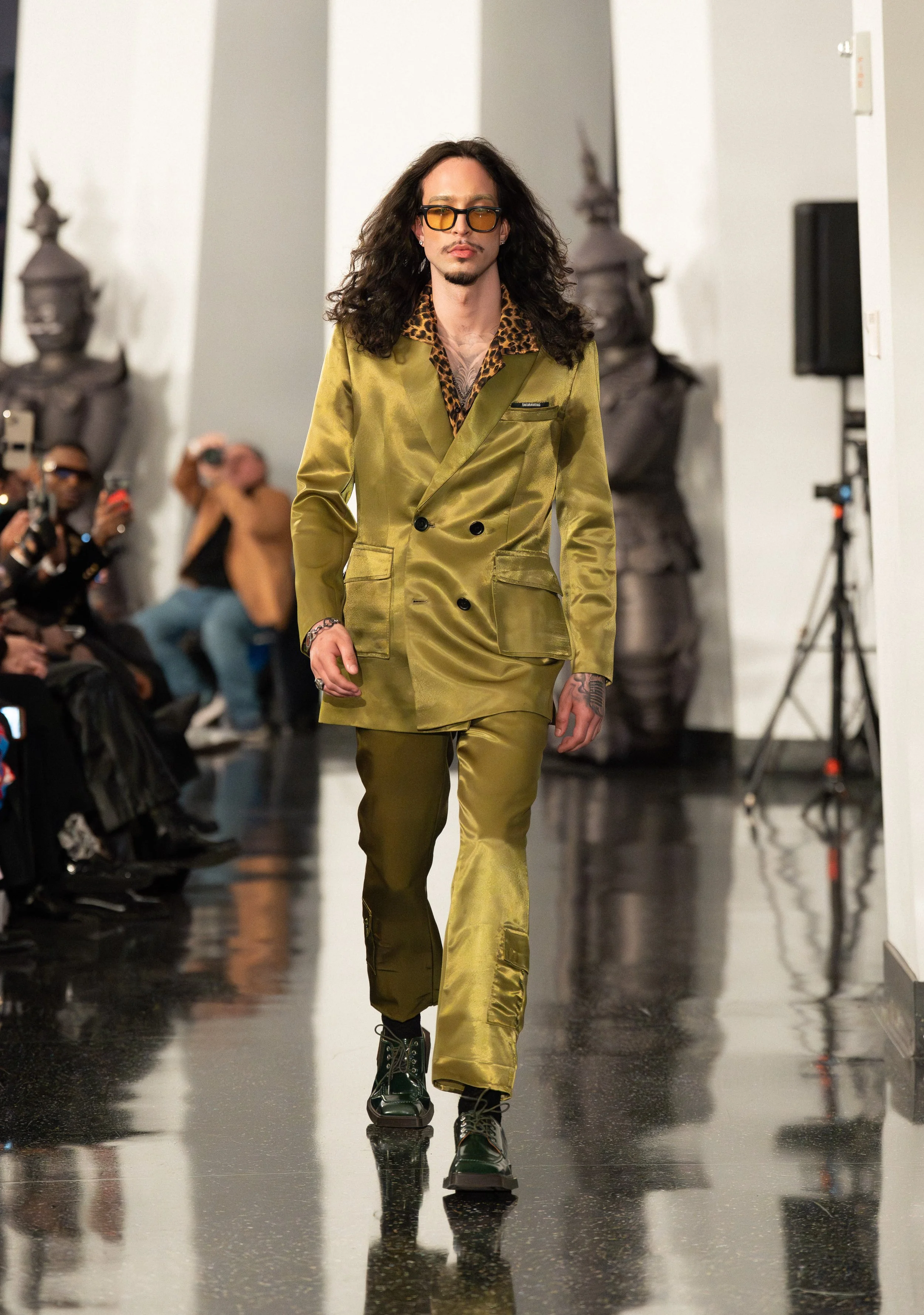 A TAKARA WONG model walking down the runway of "Up to the Sky" Bangkok designer fashion show by experiential production agency ANG Concept during NYFW at One World Observatory.
