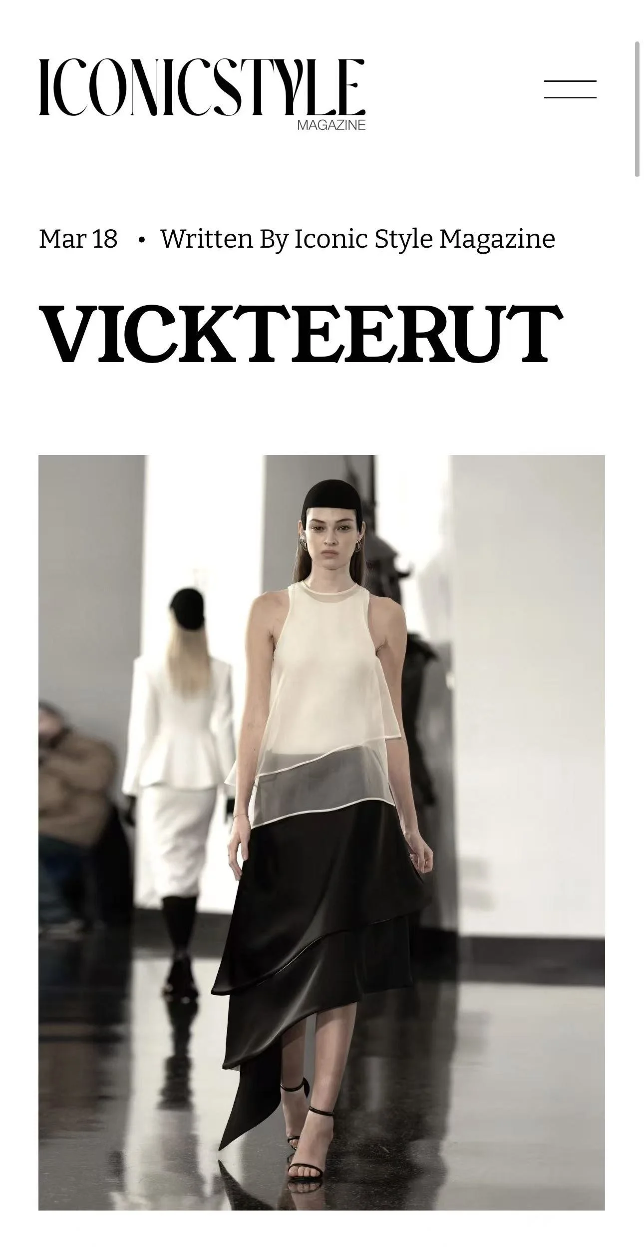 Cover of Iconic Style Magazine featuring a model in black and white high fashion runway outfit walking on a glossy floor, with a second model in background.