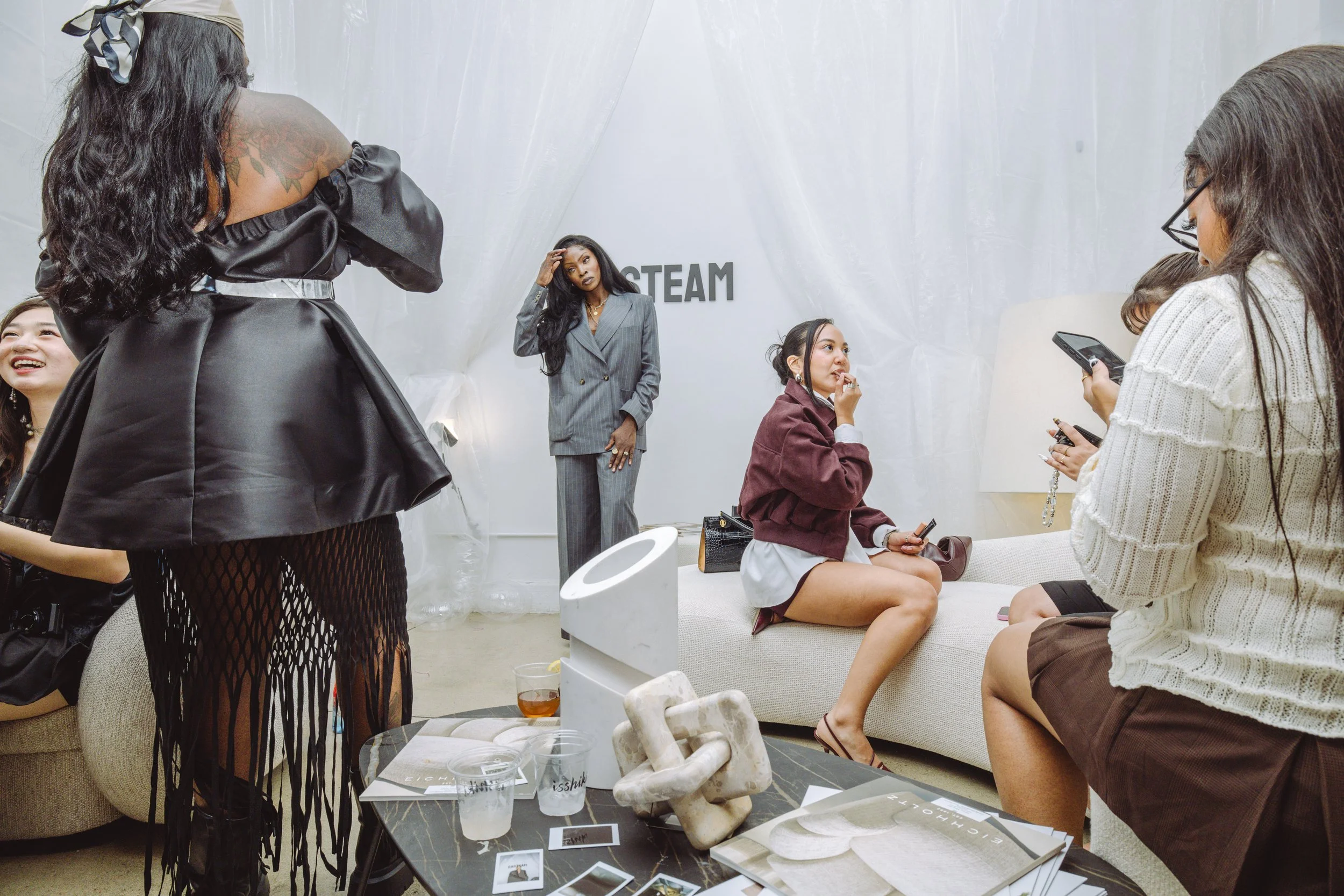 Lounge area with furniture from Eichholtz and  Caligaris New York for the NYFW SS26 EASTEAM "Rebel Heiress" show produced and designed by experiential agency ANG Concept.