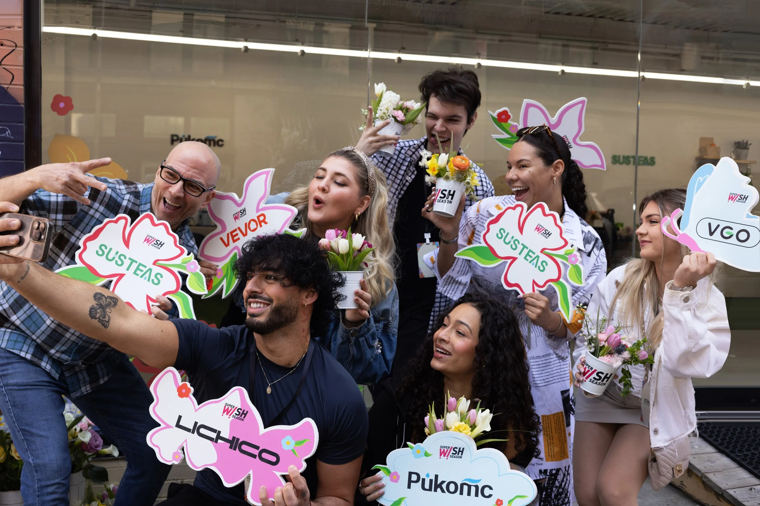 Group of KOLs captured outside of TikTok Super Wish Season pop-up activation by experiential production agency ANG Concept.