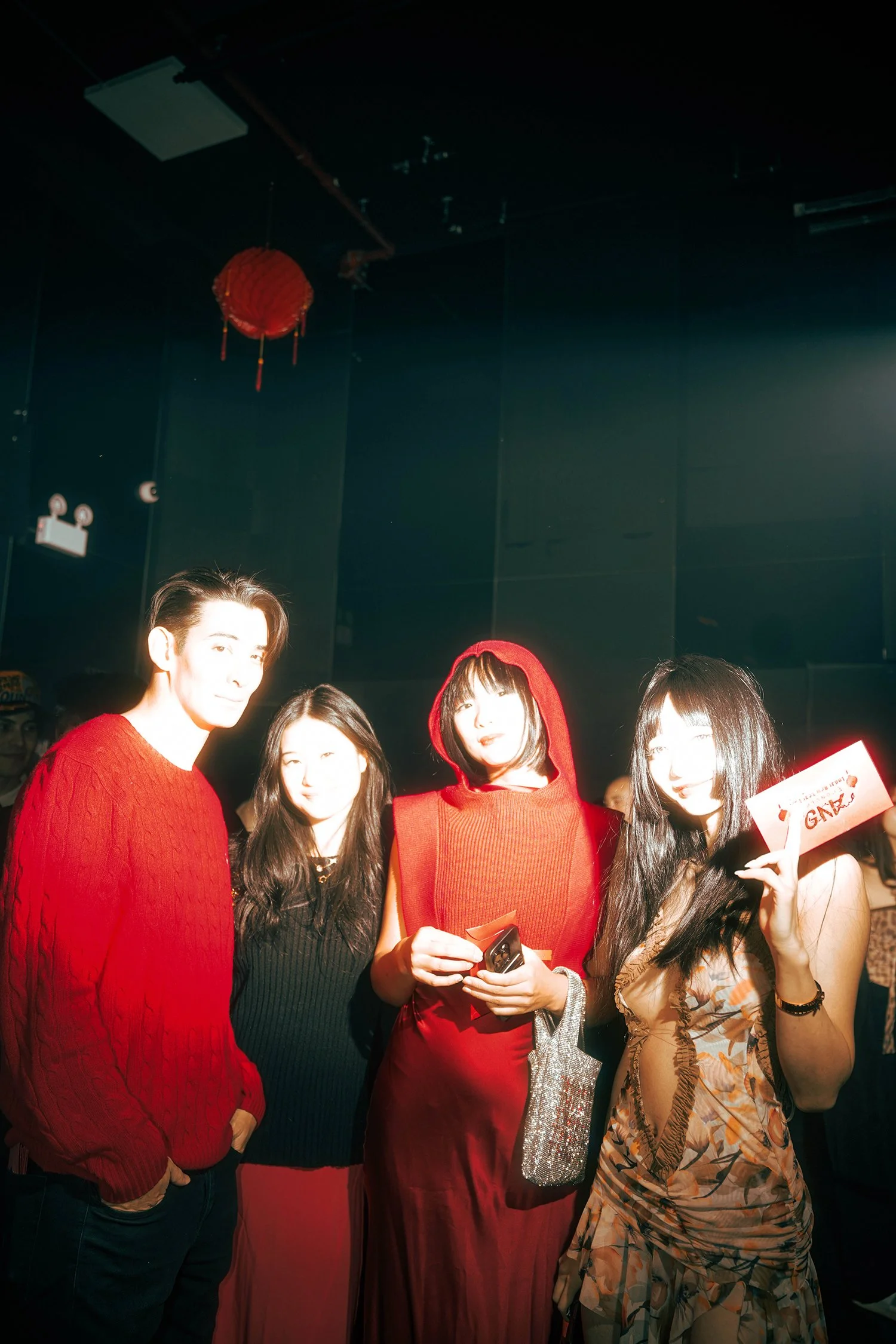 Four VIP guests standing together for a photo moment at event production agency ANG Concept's Lunar New Year Party.