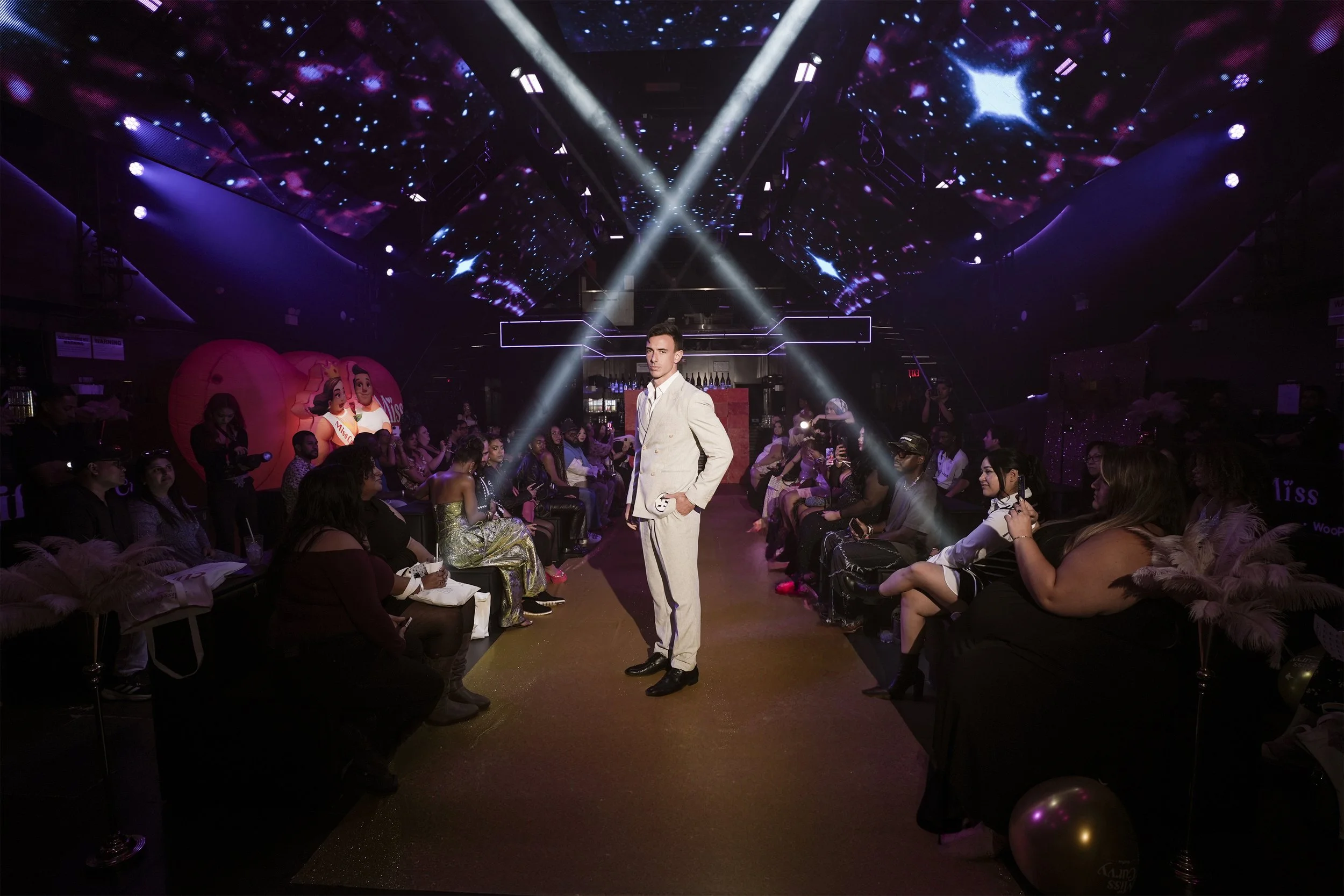 A male model as the "teaser" and "suiter" for the first Miss Curvy Pageant by WooPlus, produced by ANG Concept during NYFW 