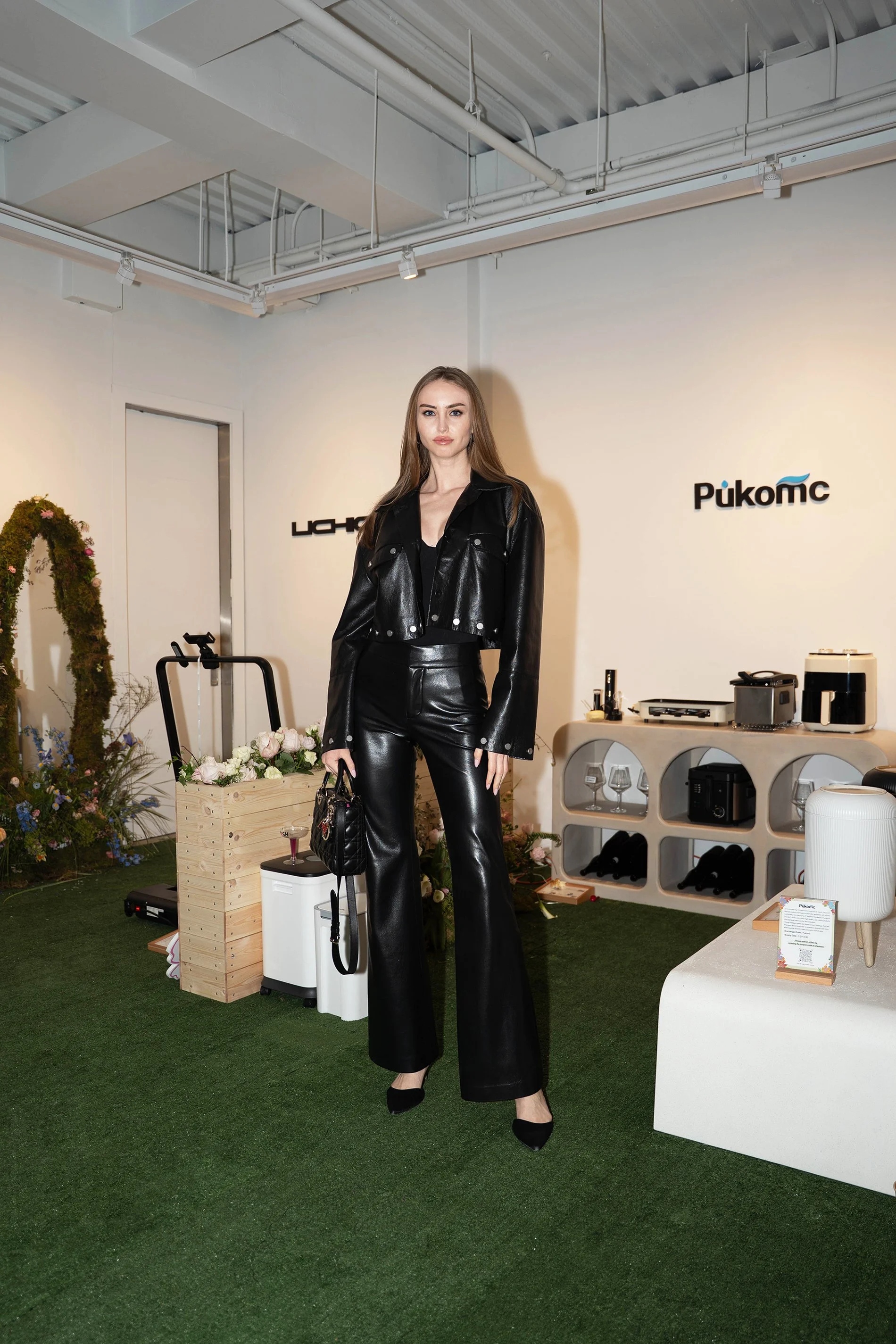 A KOL guest captured with Pukomc's brand area at the TikTok Super Wish Season pop-up activation by experiential production agency ANG Concept.