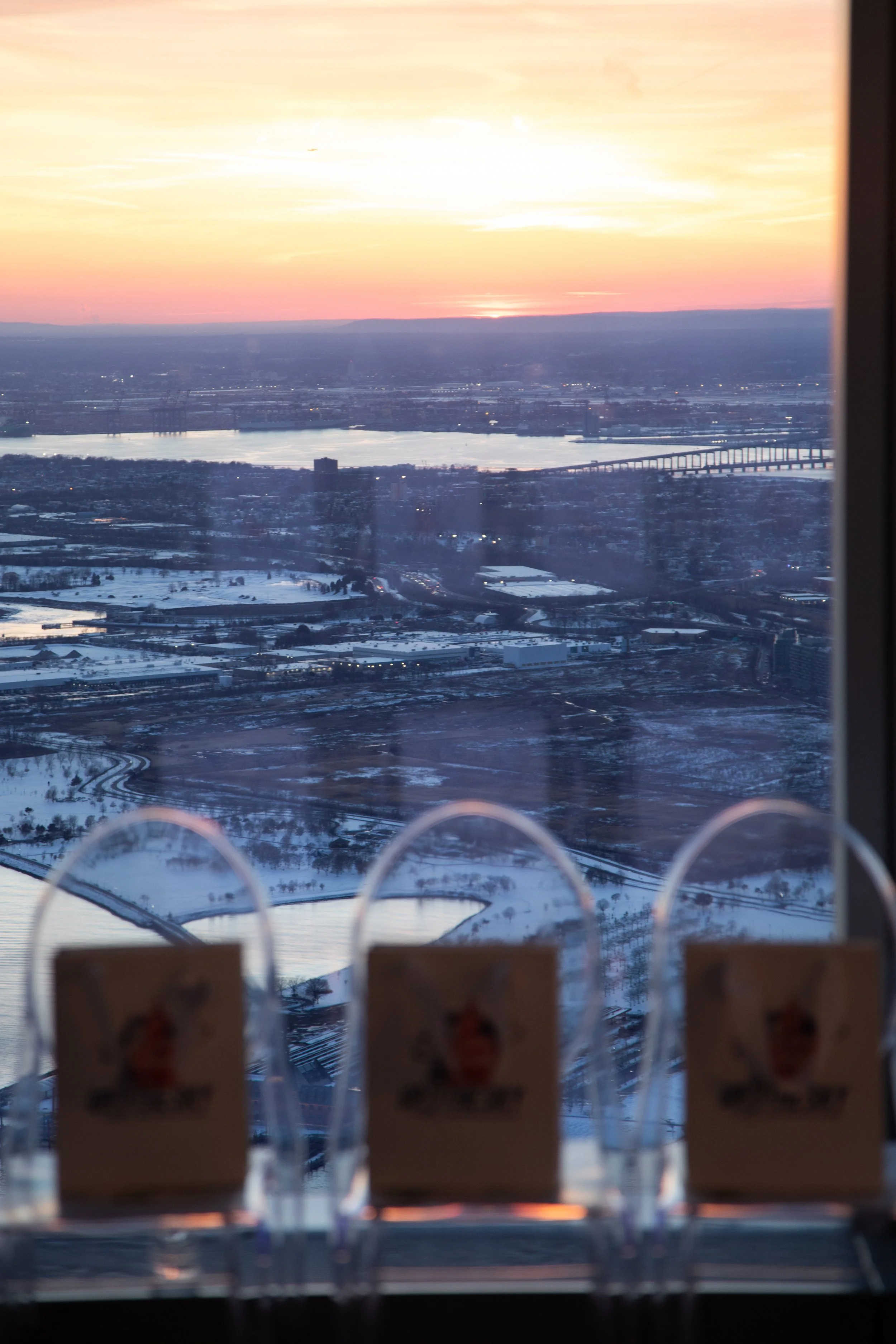 Production close-up of gift bags on ghost chairs at "Up to the Sky" Bangkok designer fashion show during NYFW at One World Observatory by experiential agency ANG Concept.