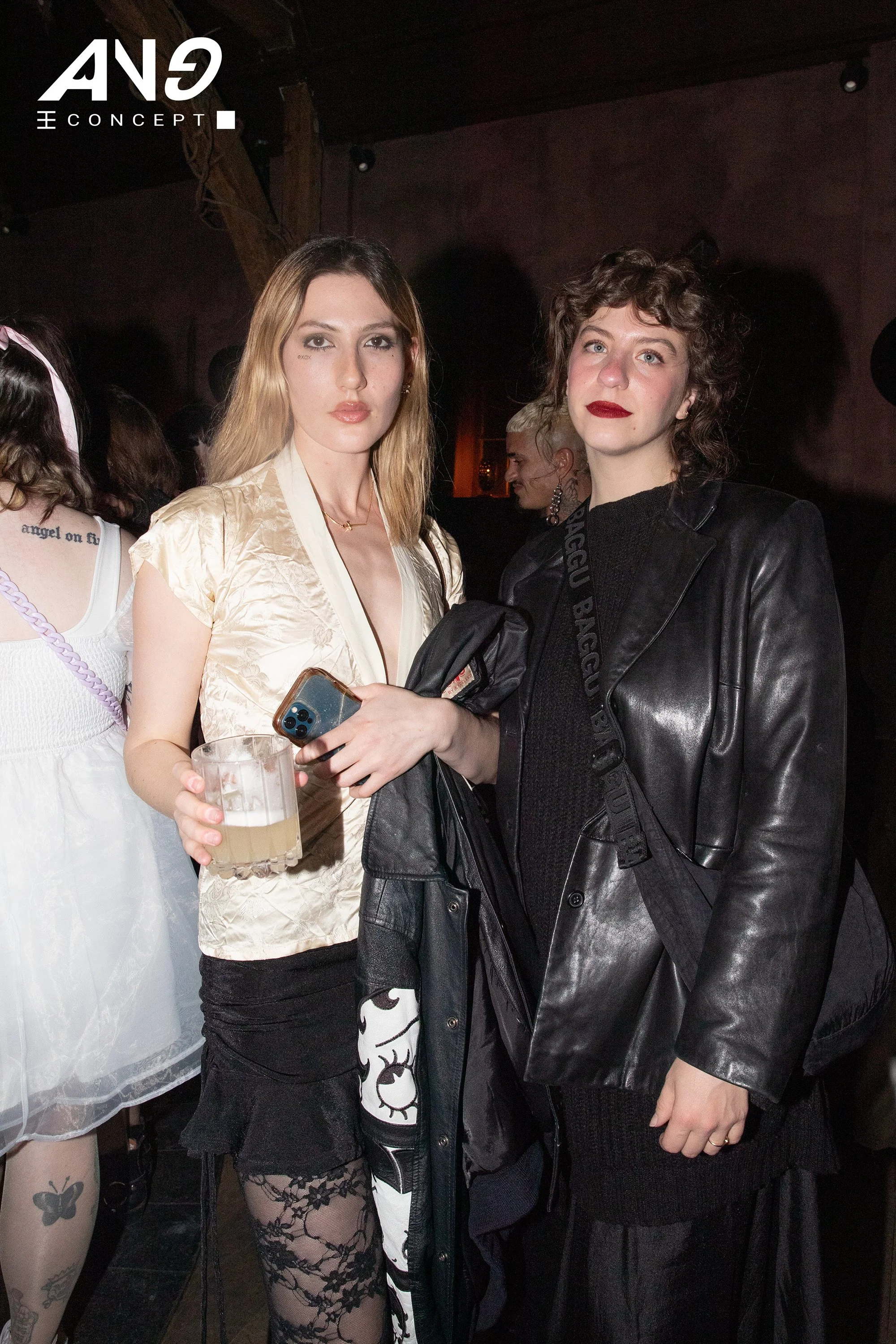 Two creators standing together at "La Genèse," an ANG Concept nighttime activation at Chapel Bar in New York.