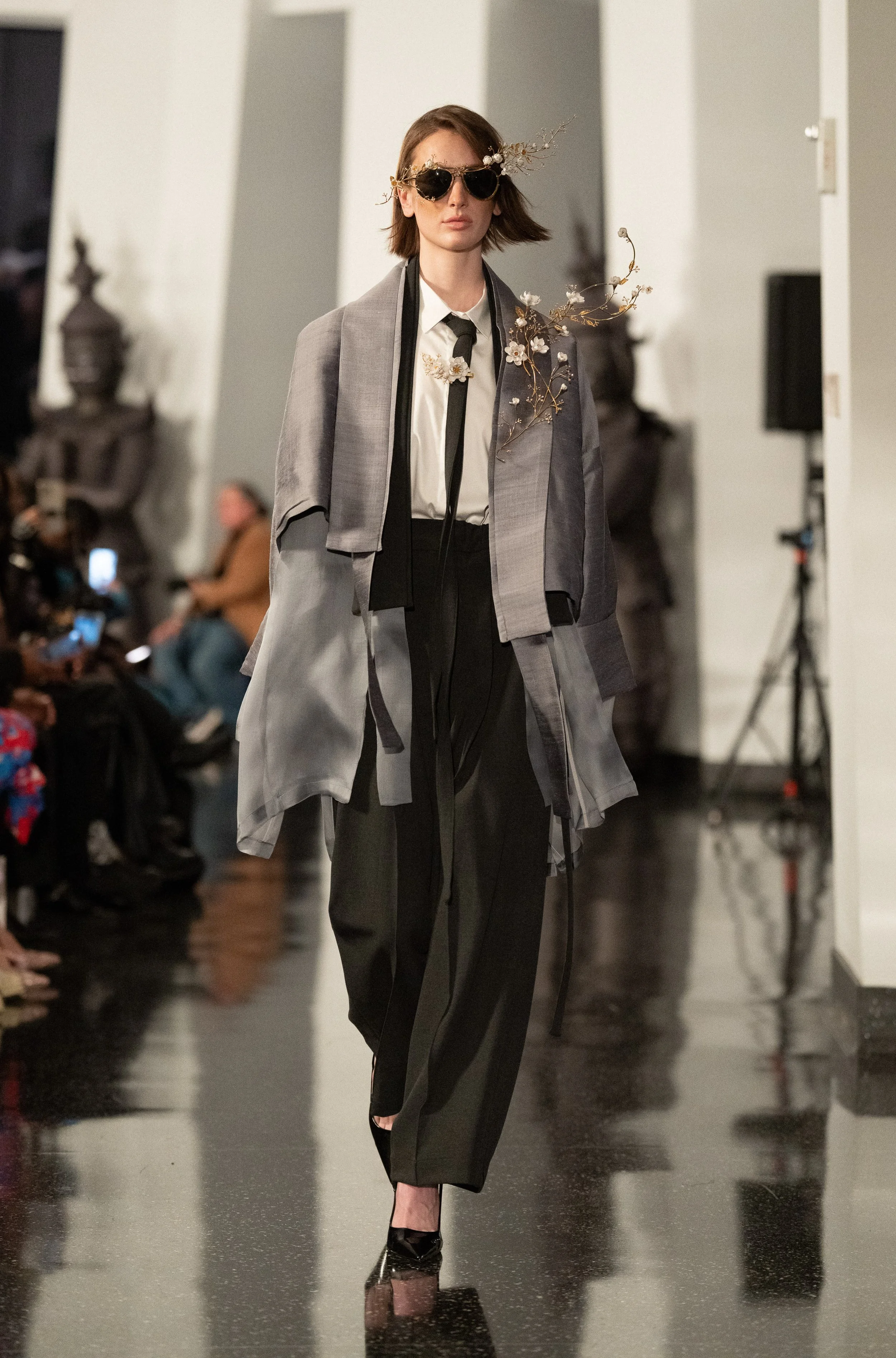 Another SARRAN model walking down the runway of "Up to the Sky" Bangkok designer fashion show by experiential production agency ANG Concept during NYFW at One World Observatory.