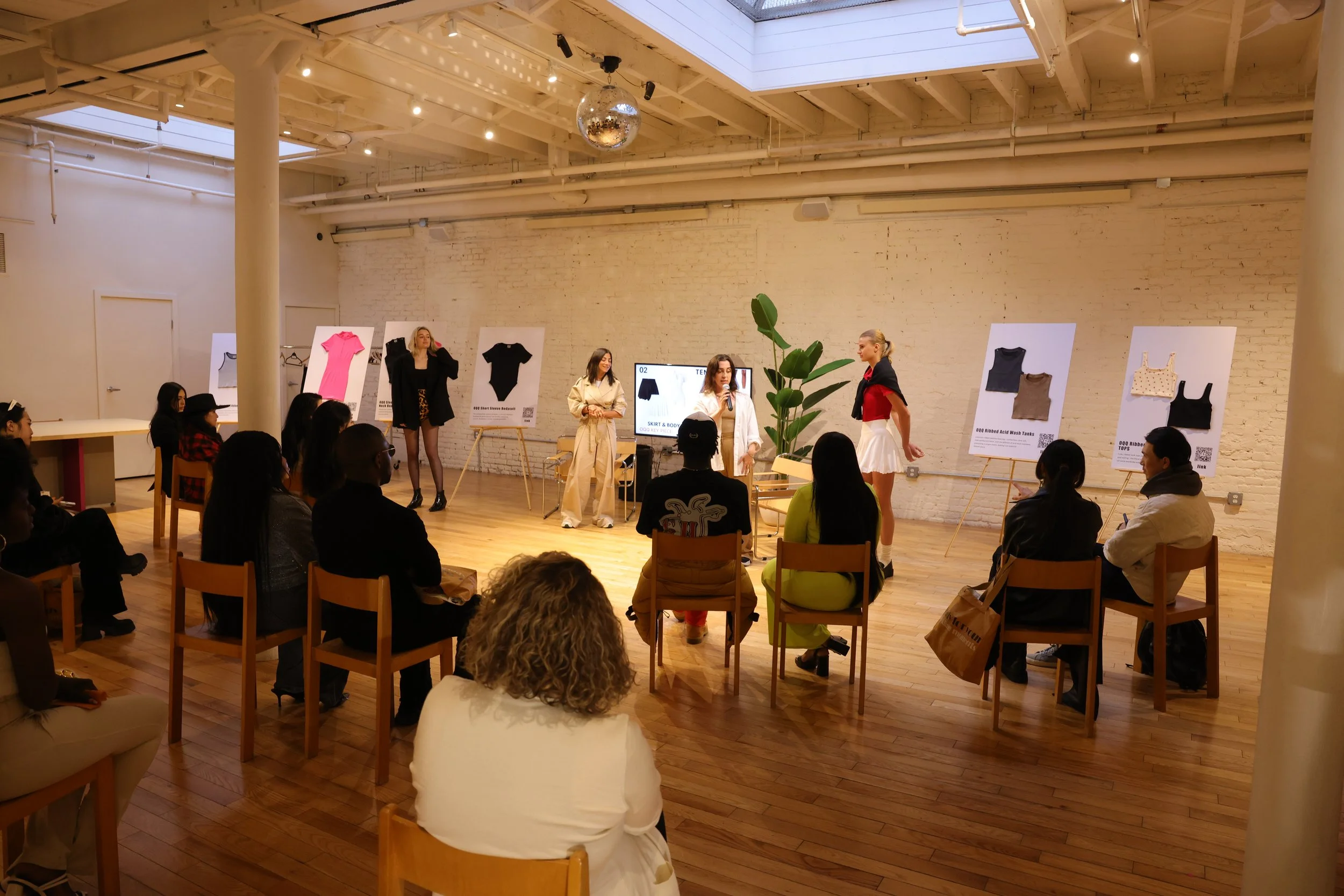 Brand activation's main event, a live fashion panel with real-time demonstrations from Women's Activewear, Gymwear, and Athleisure brand OQQ's press conference in Williamsburg.