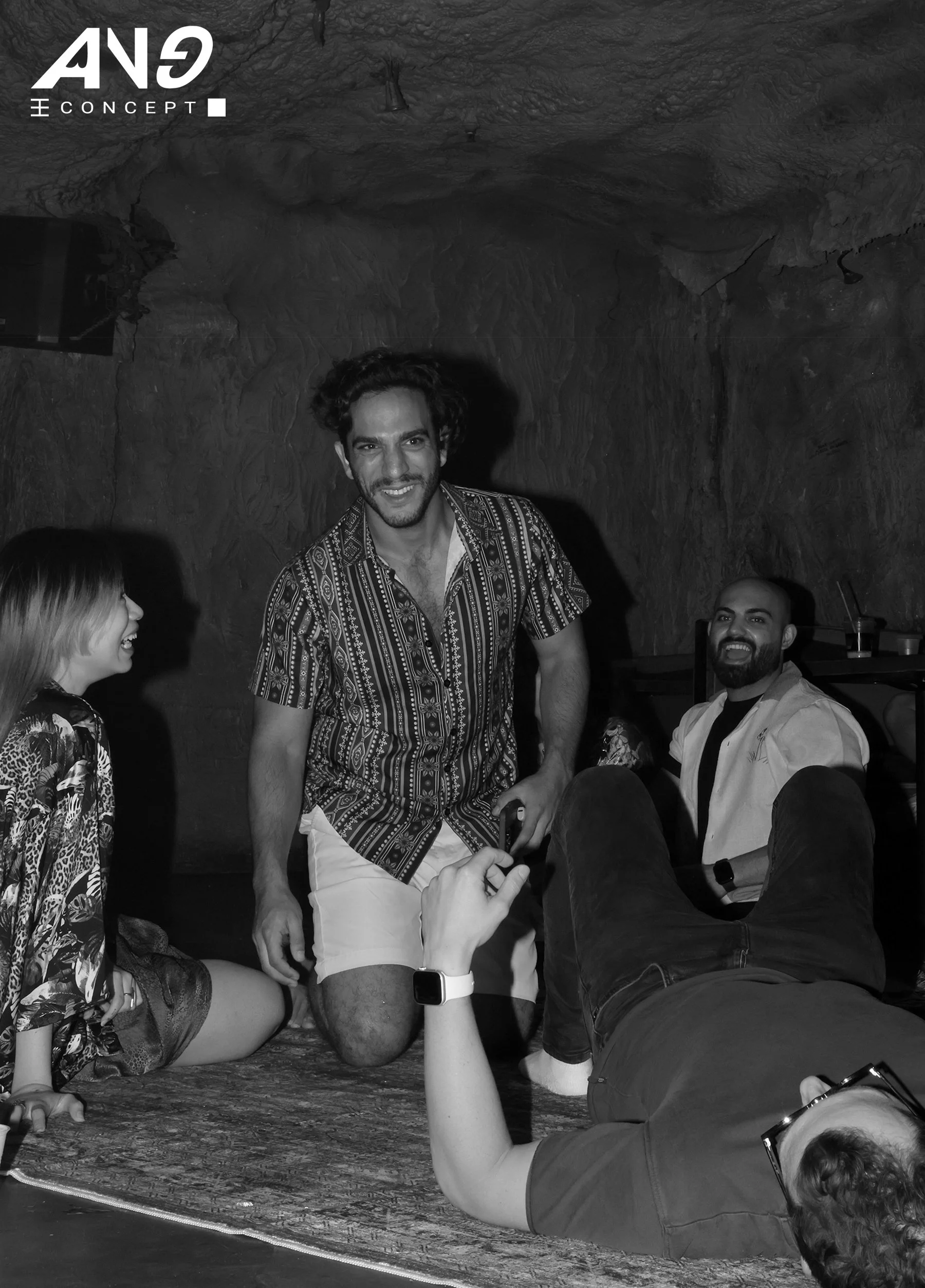 A group enjoying house music at a lay-down party production in a cave by event production agency ANG Concept on the Lower East Side, New York.