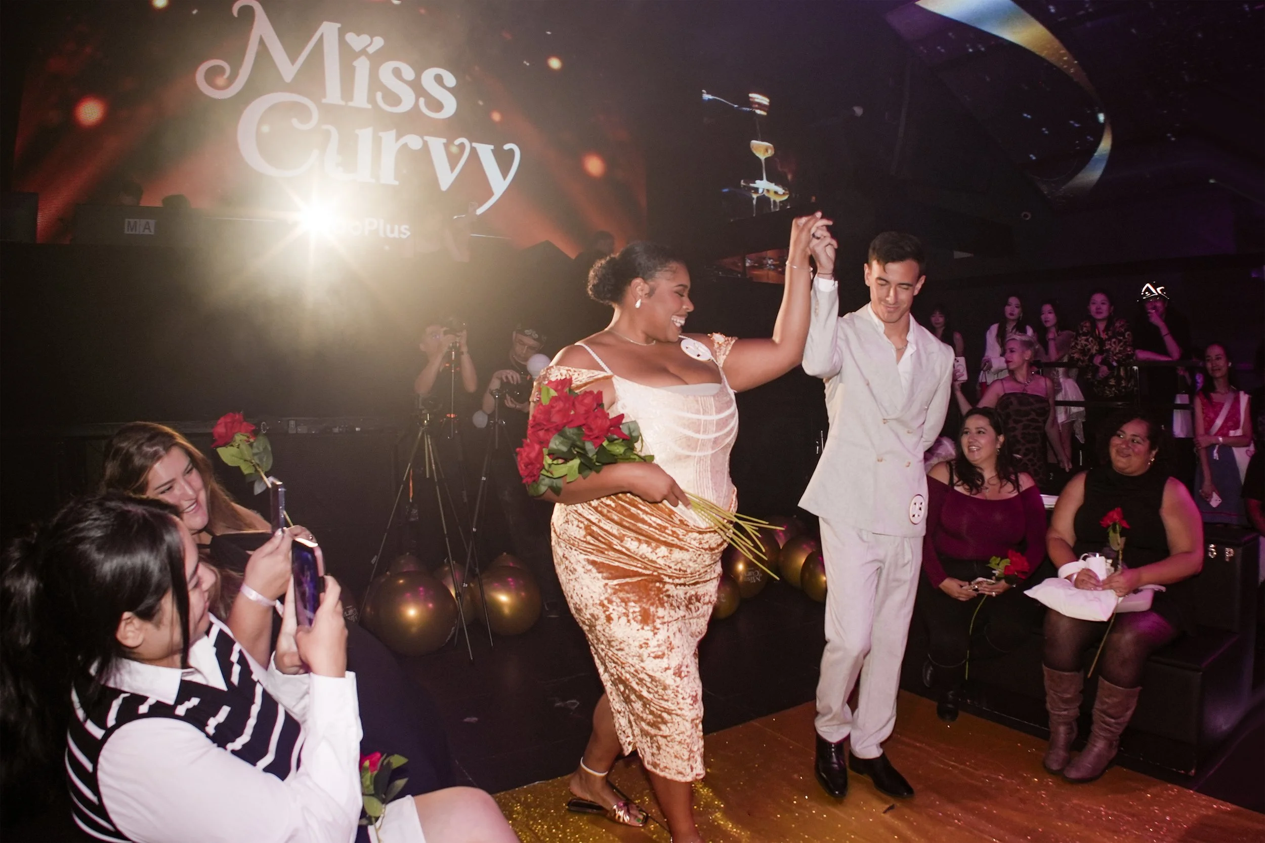 "Successfully matched" dating app users as models in a Lacemade dress at the Miss Curvy Pageant runway show by dating app WooPlus, by experiential production agency ANG Concept during NYFW.