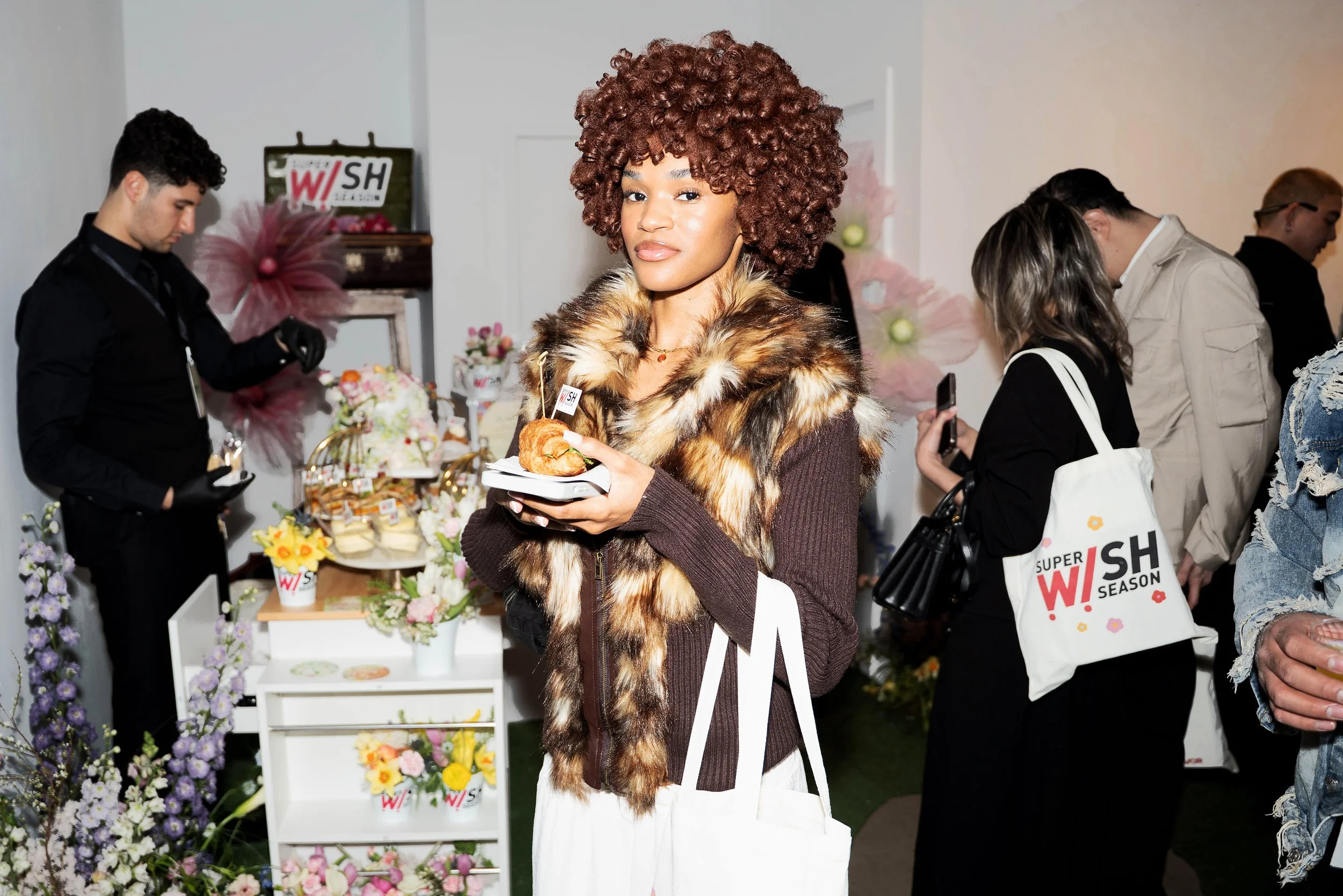 A KOL guest captured at the bar of TikTok Super Wish Season pop-up activation by experiential production agency ANG Concept.