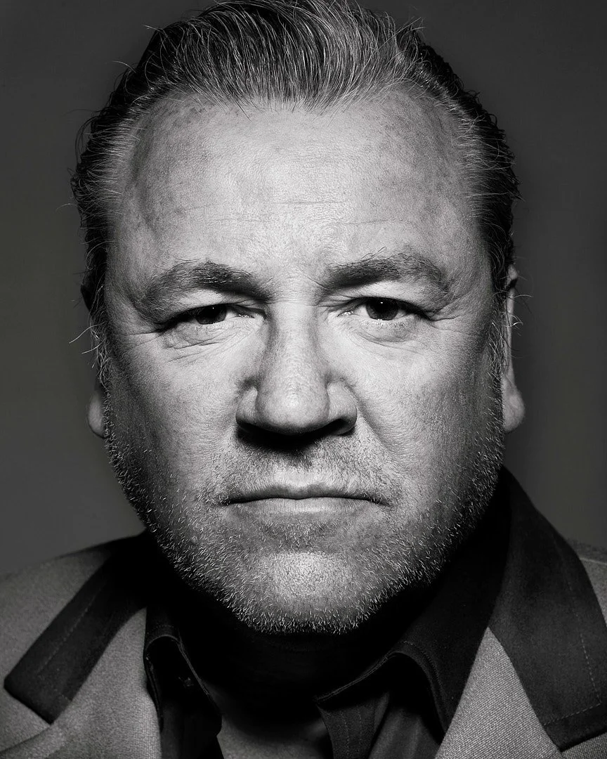 Black and white studio portrait of English Actor Ray Winstone
