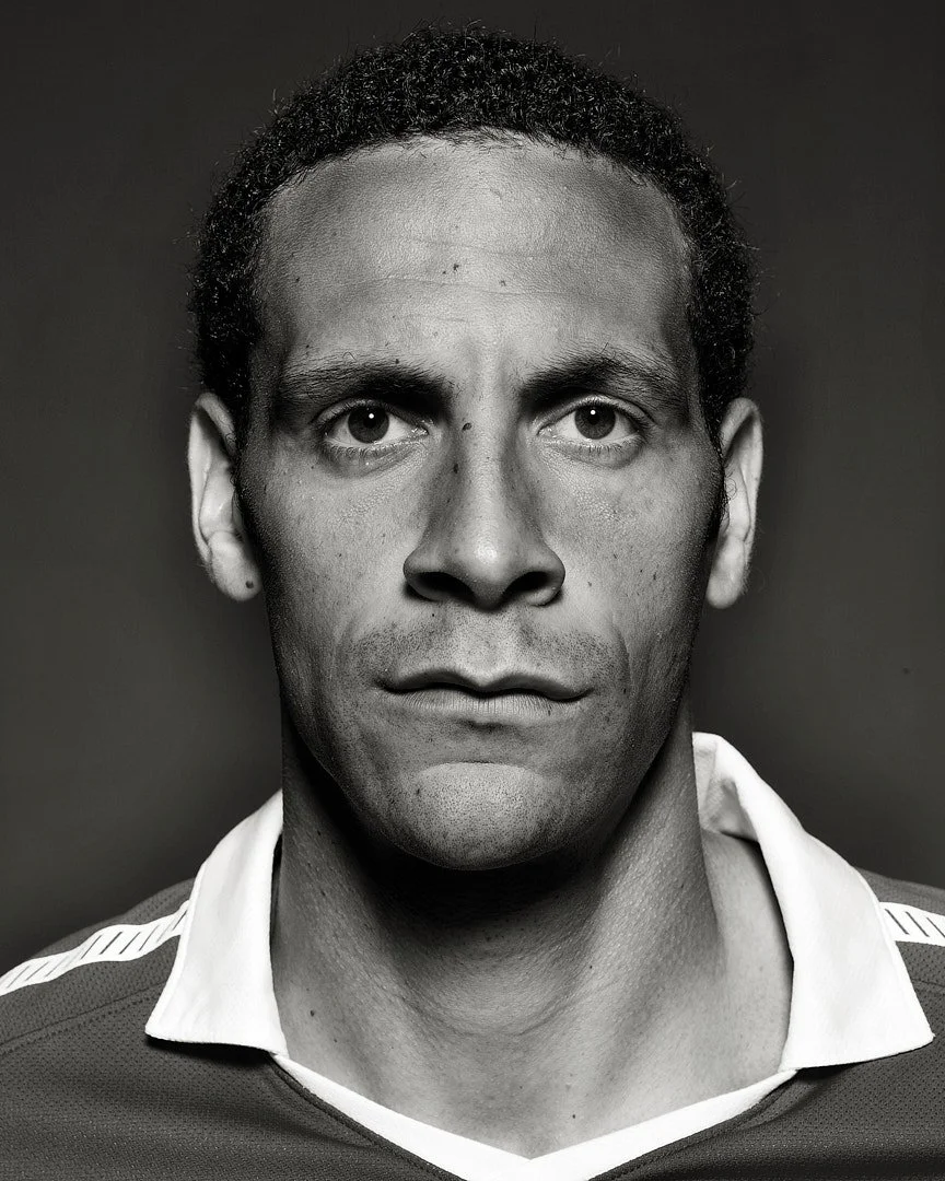 Black and white studio portrait of English football Player Rio Ferdinand