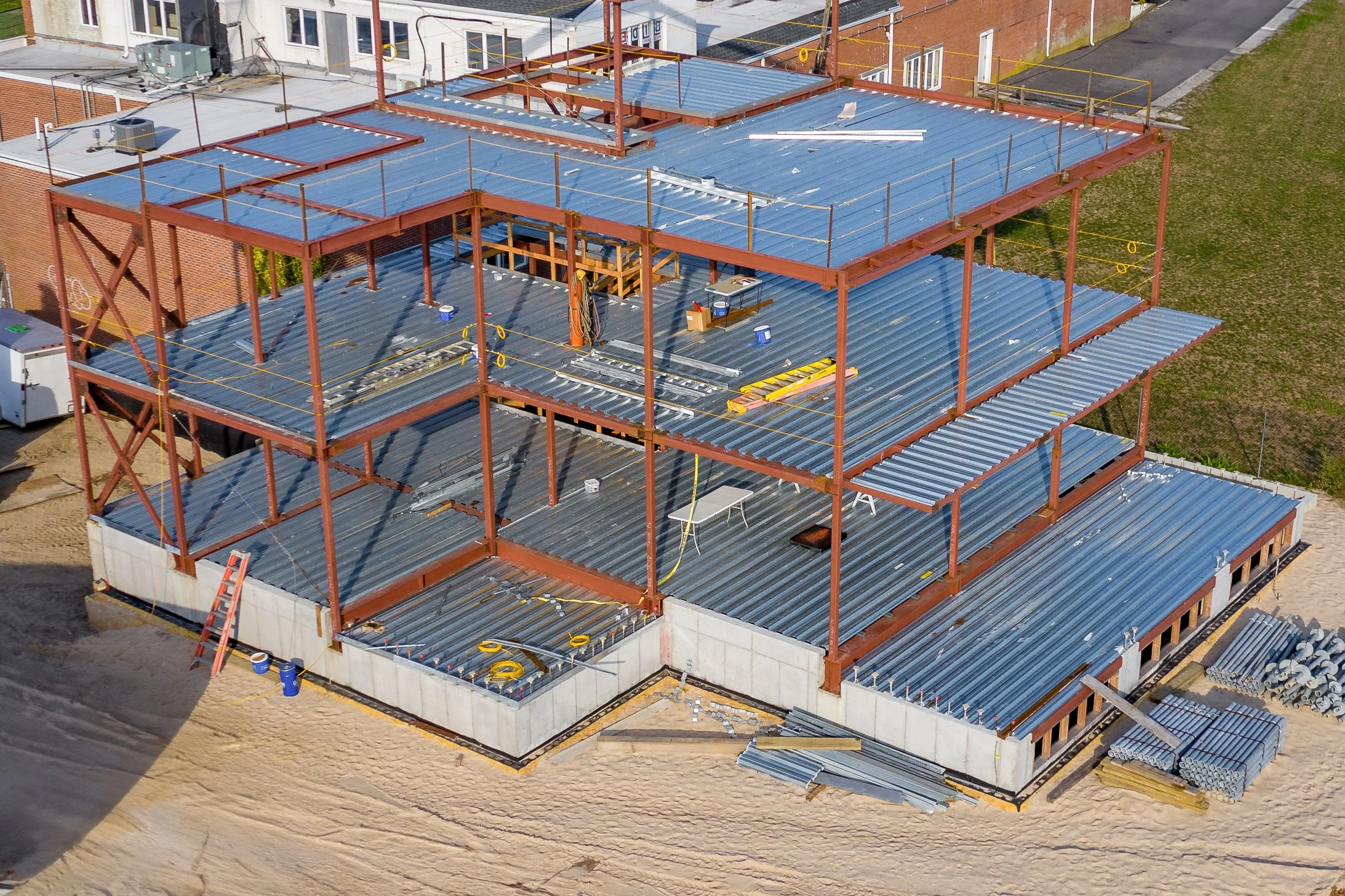 An aerial view of a multi-story building under construction.