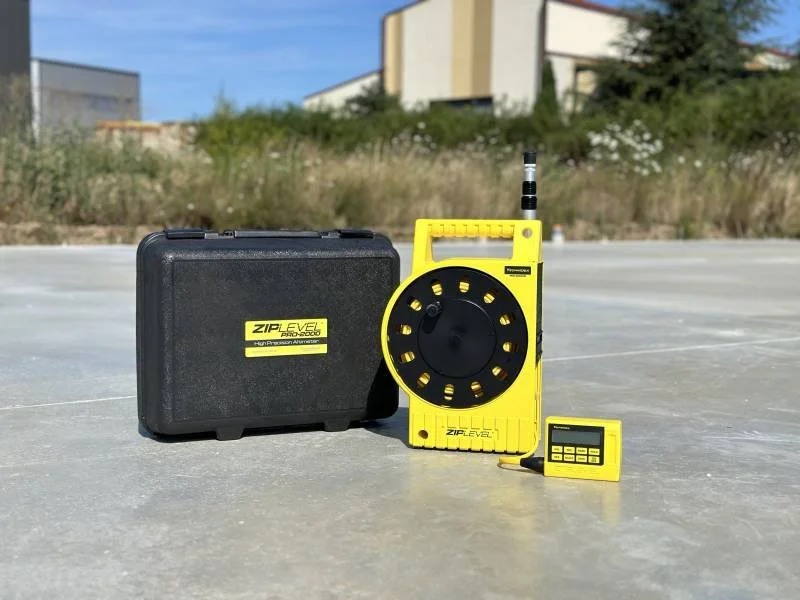 Home inspector Daniel using a moisture meter on interior drywall to check for hidden water damage in Spring, Texas.