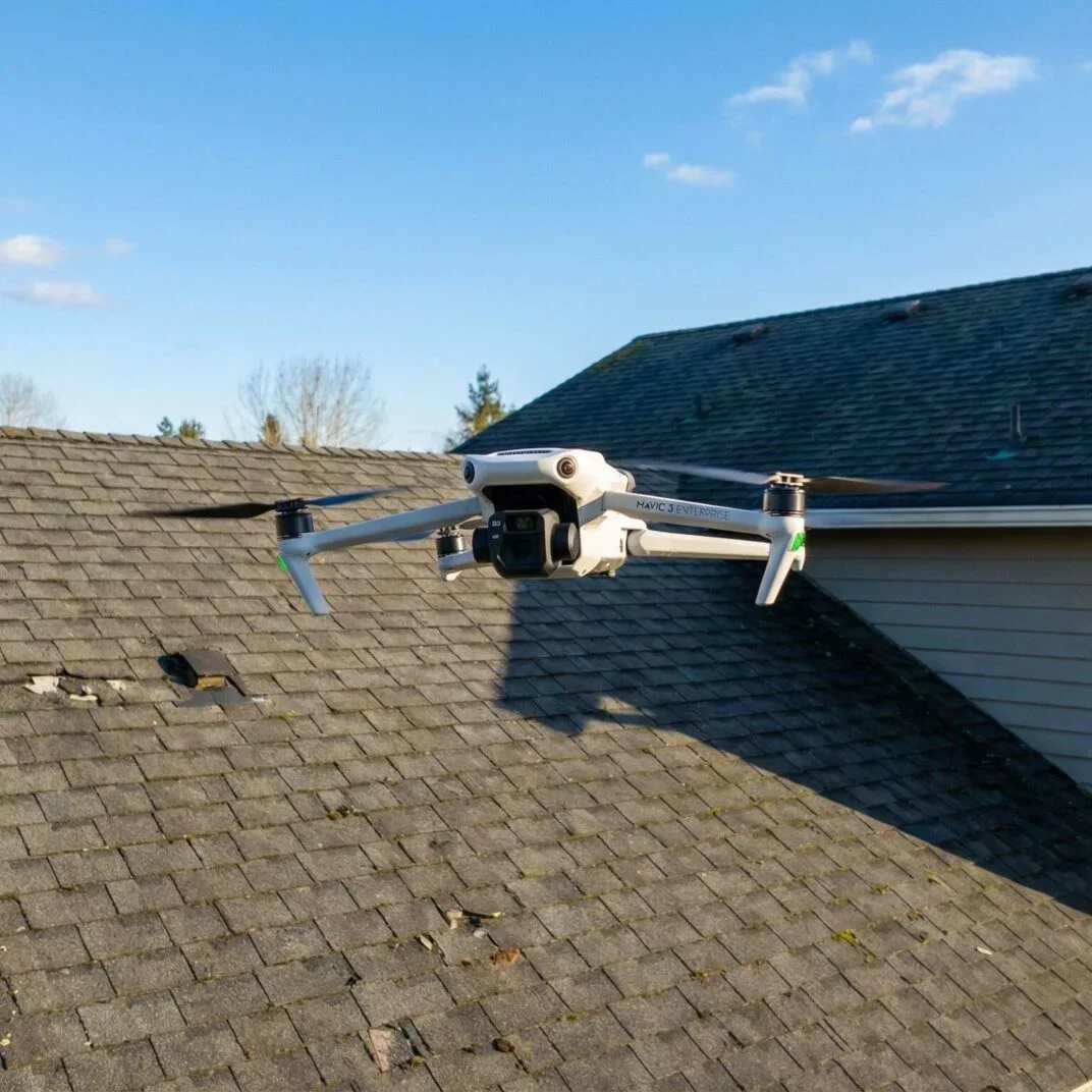 Drone performing a roof inspection during a home inspection in The Woodlands, Texas.