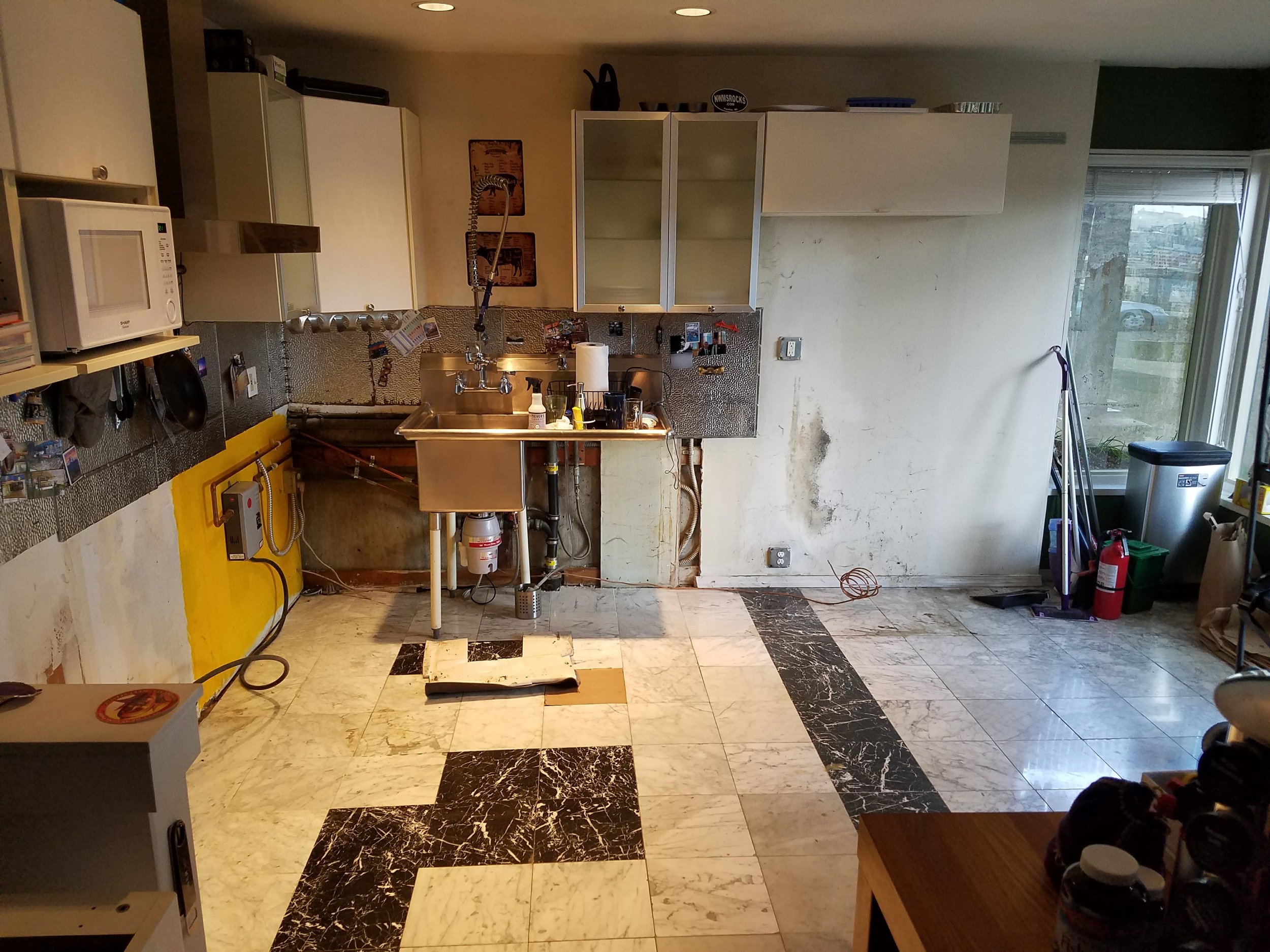 Kitchen need a face lift happy or old tile starting to chip and break.