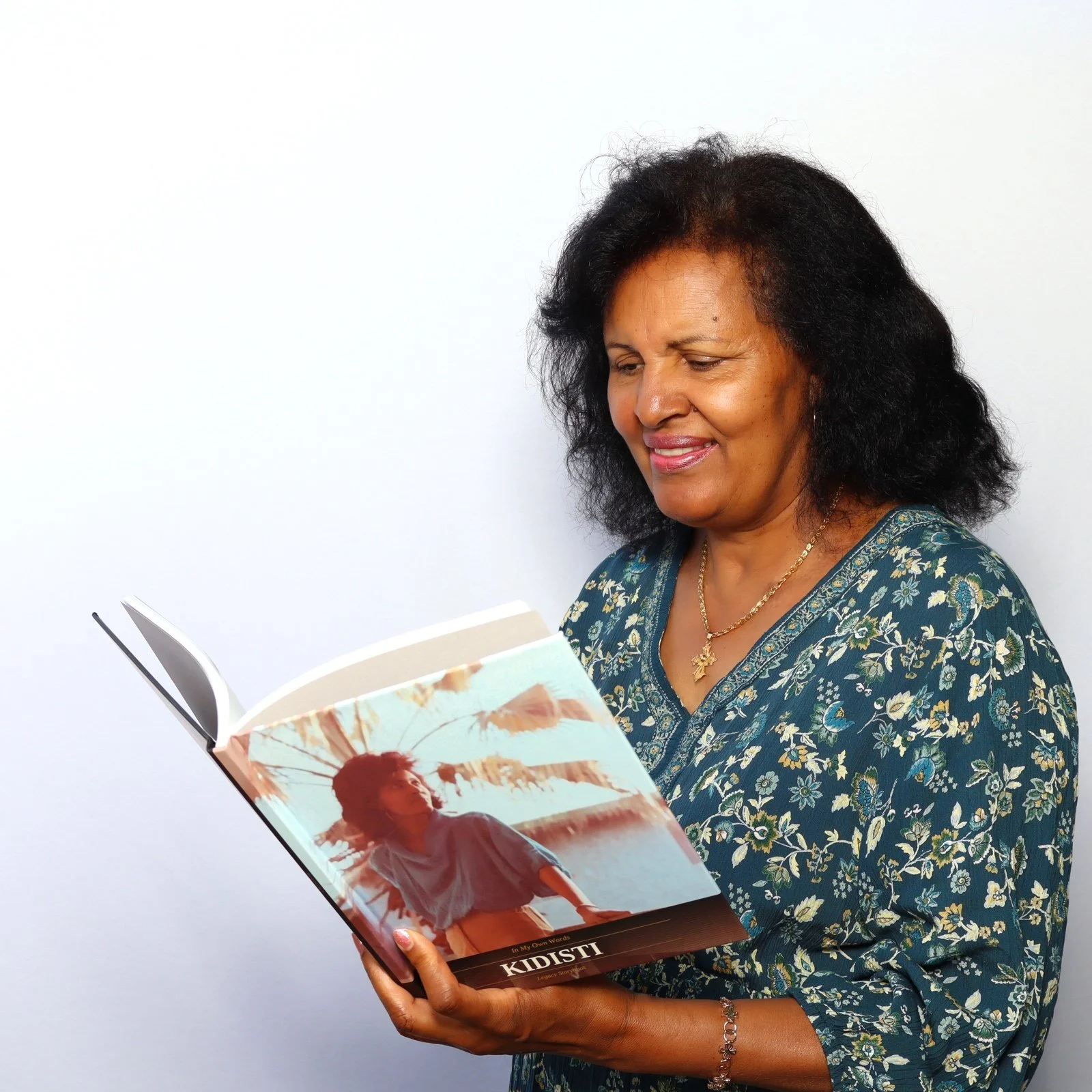 Kidisti reading her Legacy Storybook memoir — founder-led biography writing service Los Angeles