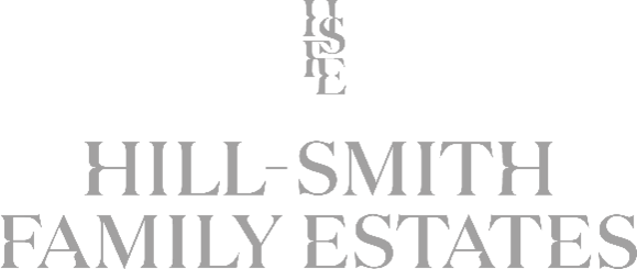 Logo of Hill-Smith Family Estates with a stylized letter 'S' at the top.