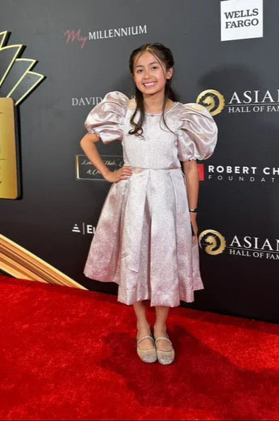 Madeleine is wearing Aurora Puff Sleeve Pearl Dress