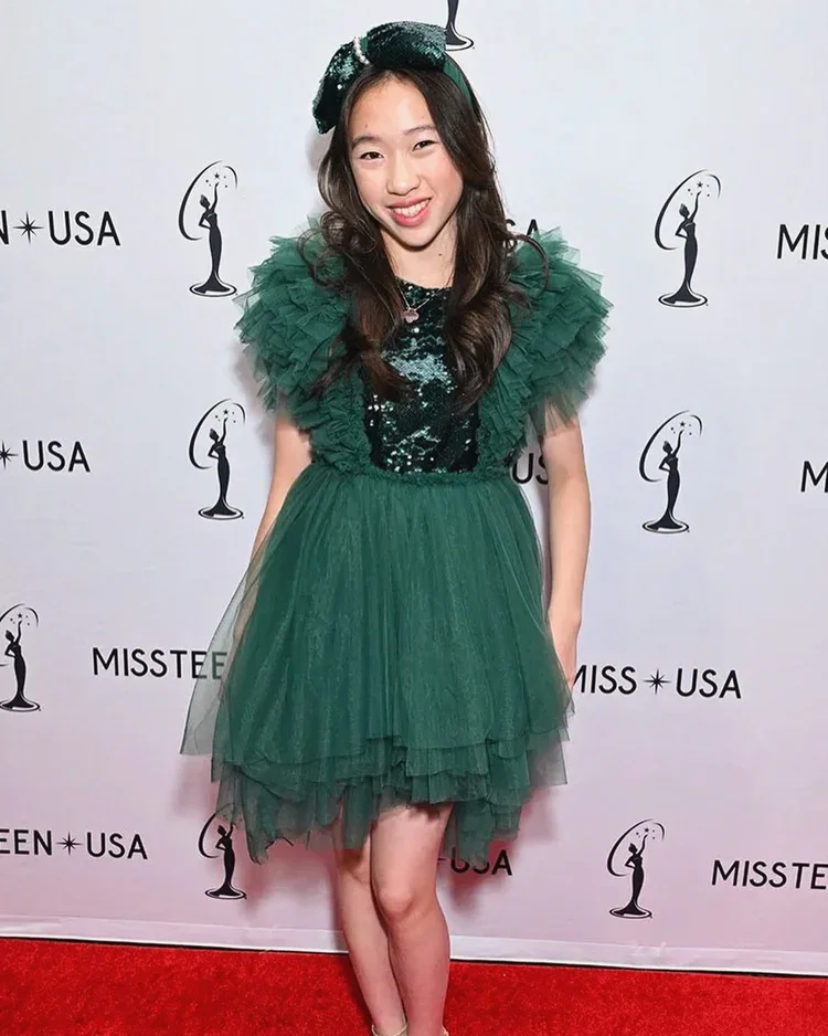 Reagan is wearing Merida Sequin Tutu Green Emerald Dress