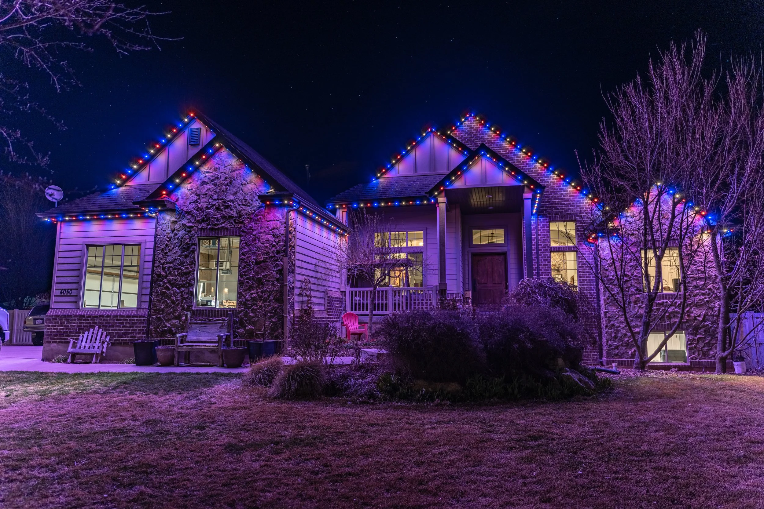 Permanent LED lighting on a Utah home displaying vibrant customizable colors through app control.