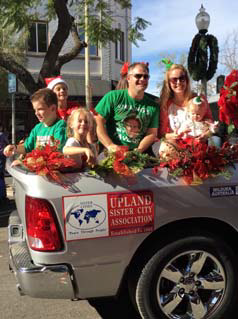 meg and tom's family in car in Christmas parade.png