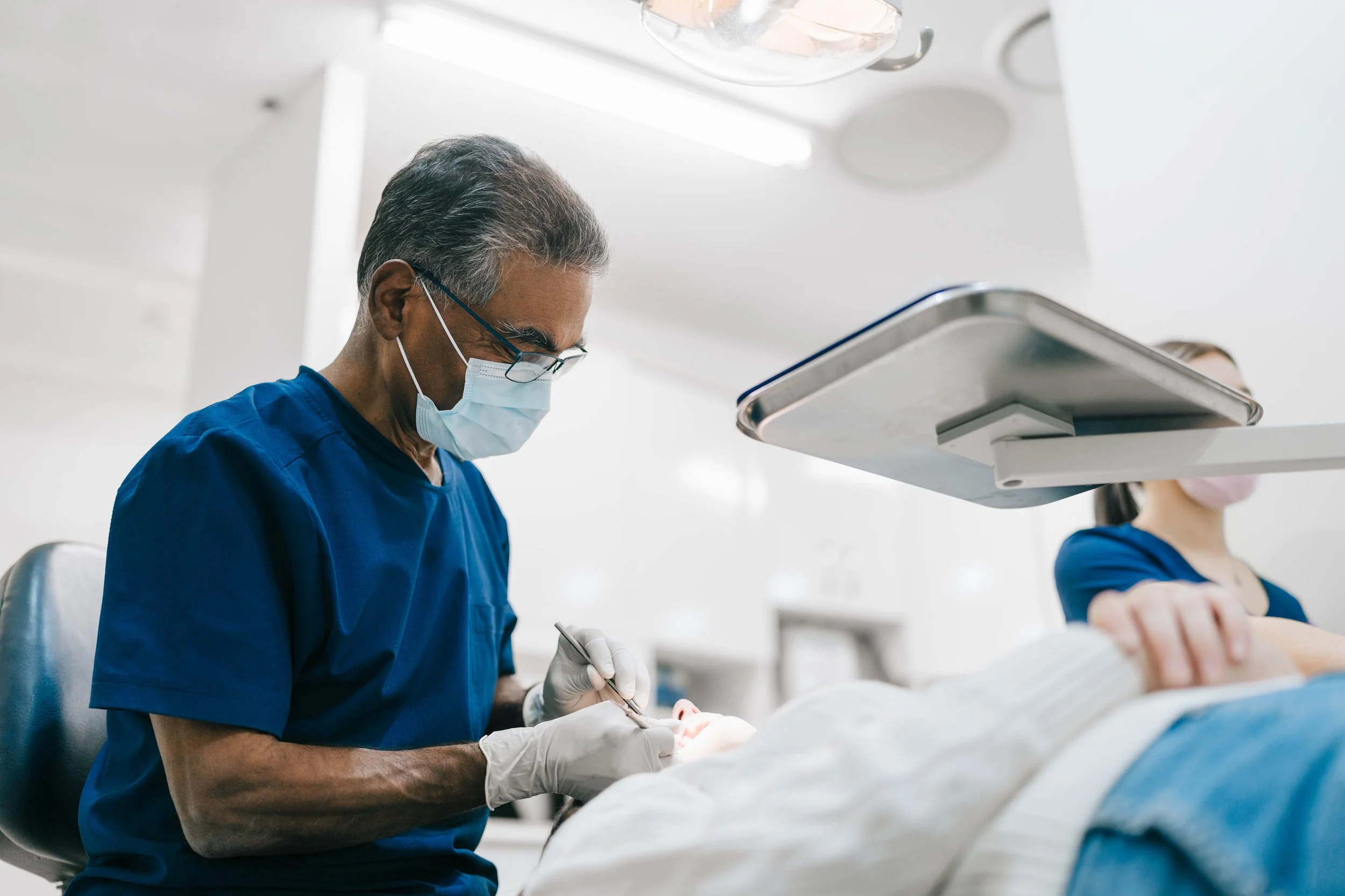 Dr. Neil Pinto performing dental work