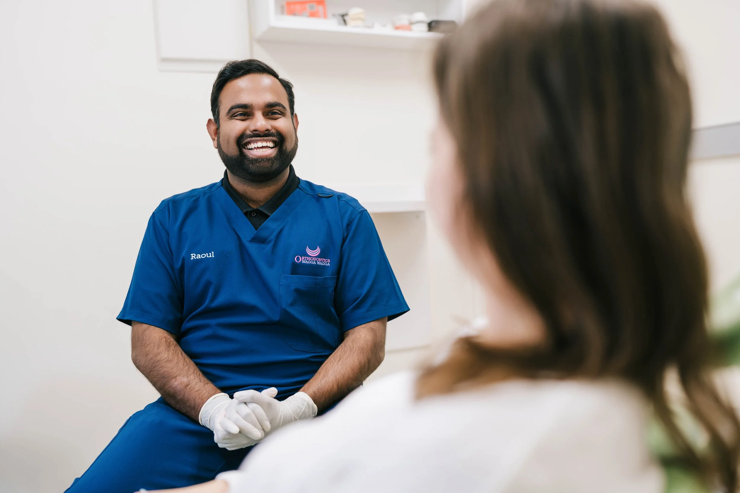 Raoul Mascarenha consulting with a patient in a clinical setting.
