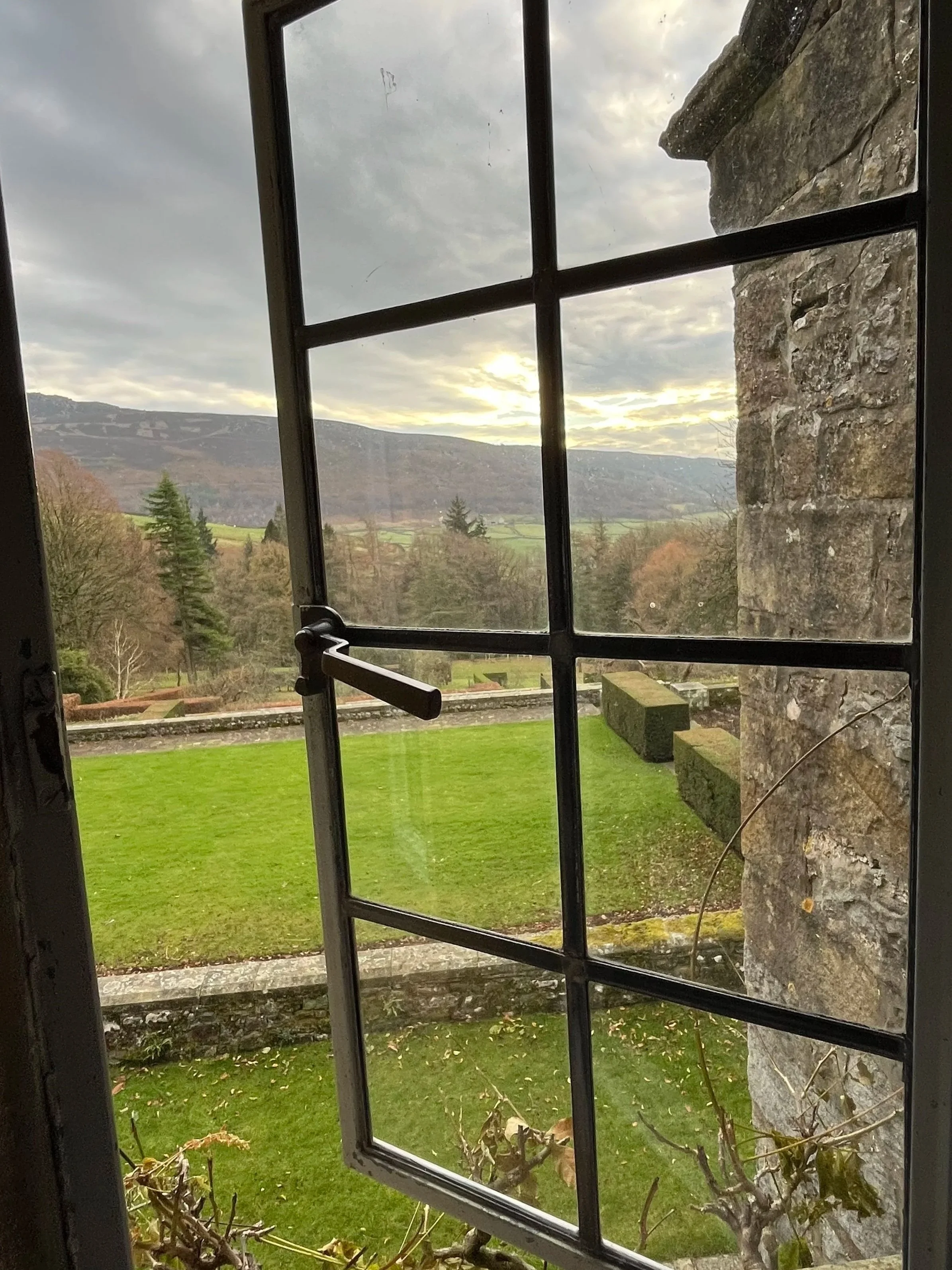 View through first floor window to gardens and Simon's Seat