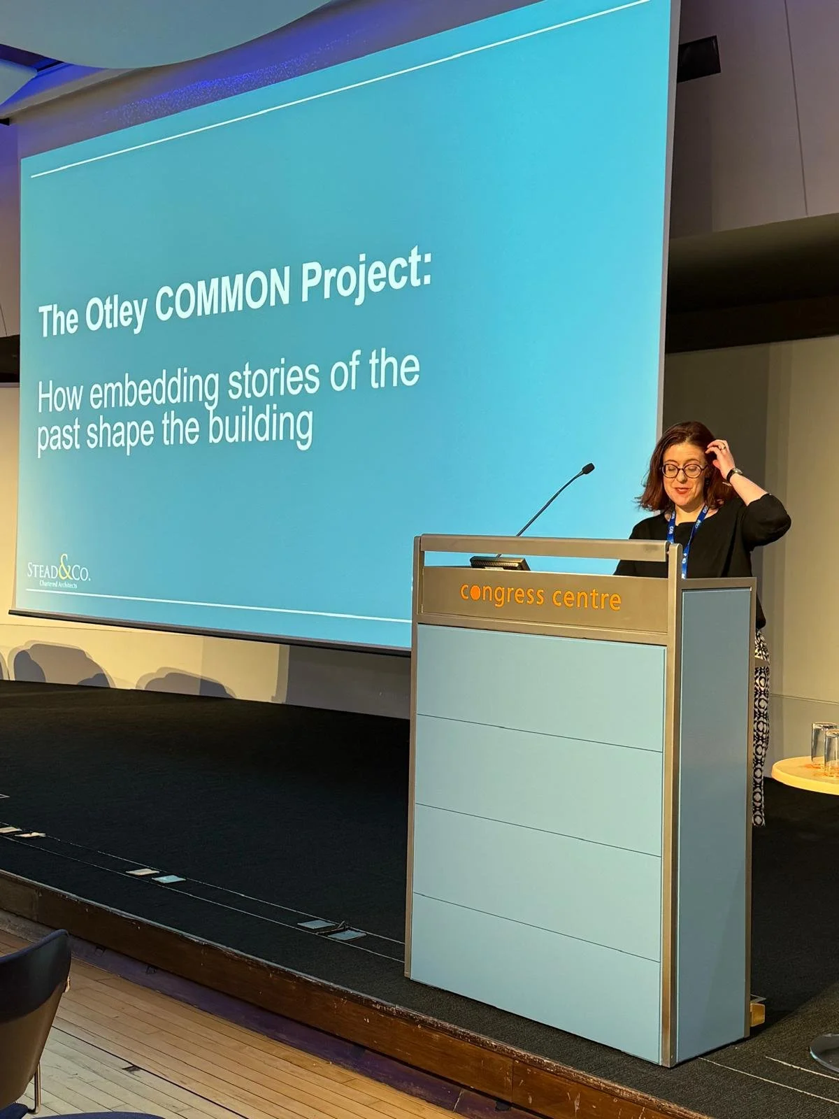 Stefanie giving a presentation for the 'The Otley COMMON Project: How embedding stories of the past shape the building.'