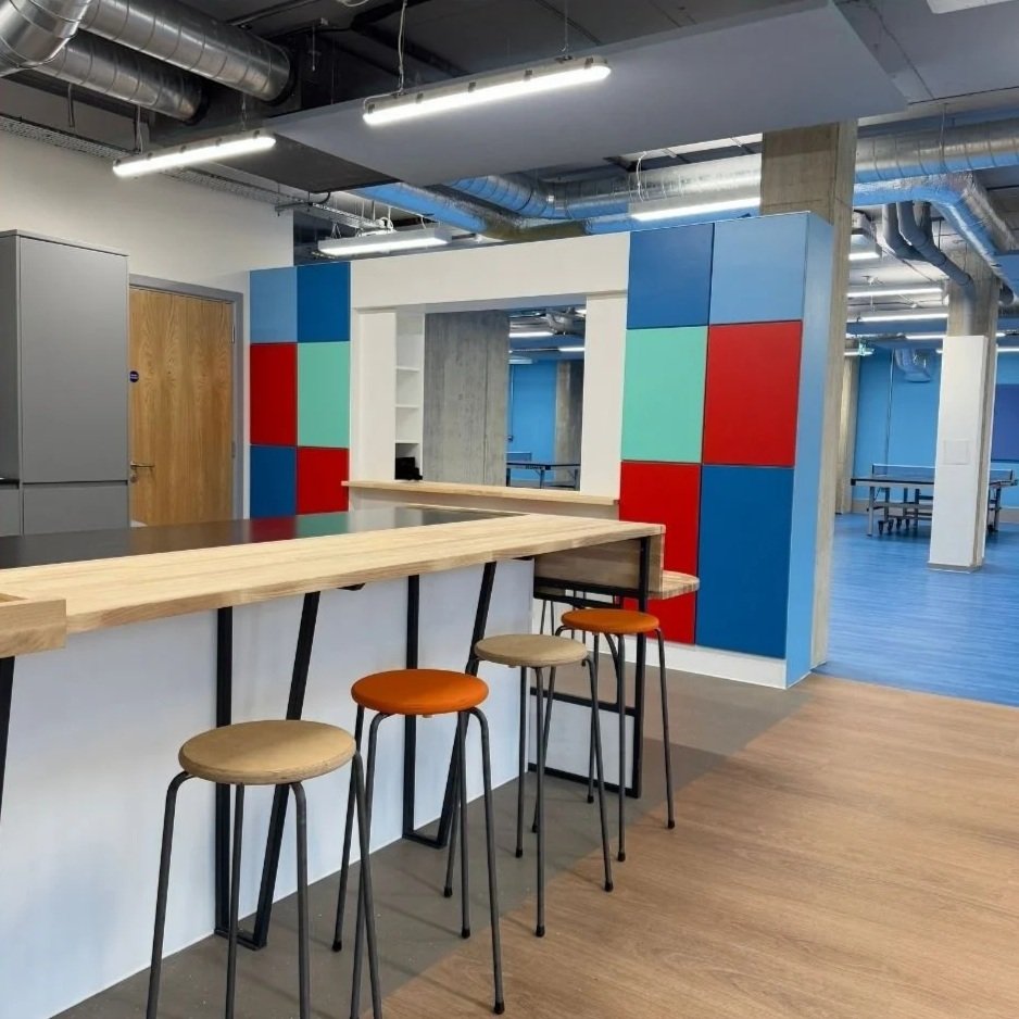Breakfast bar at the kitchen with viewing window over play area