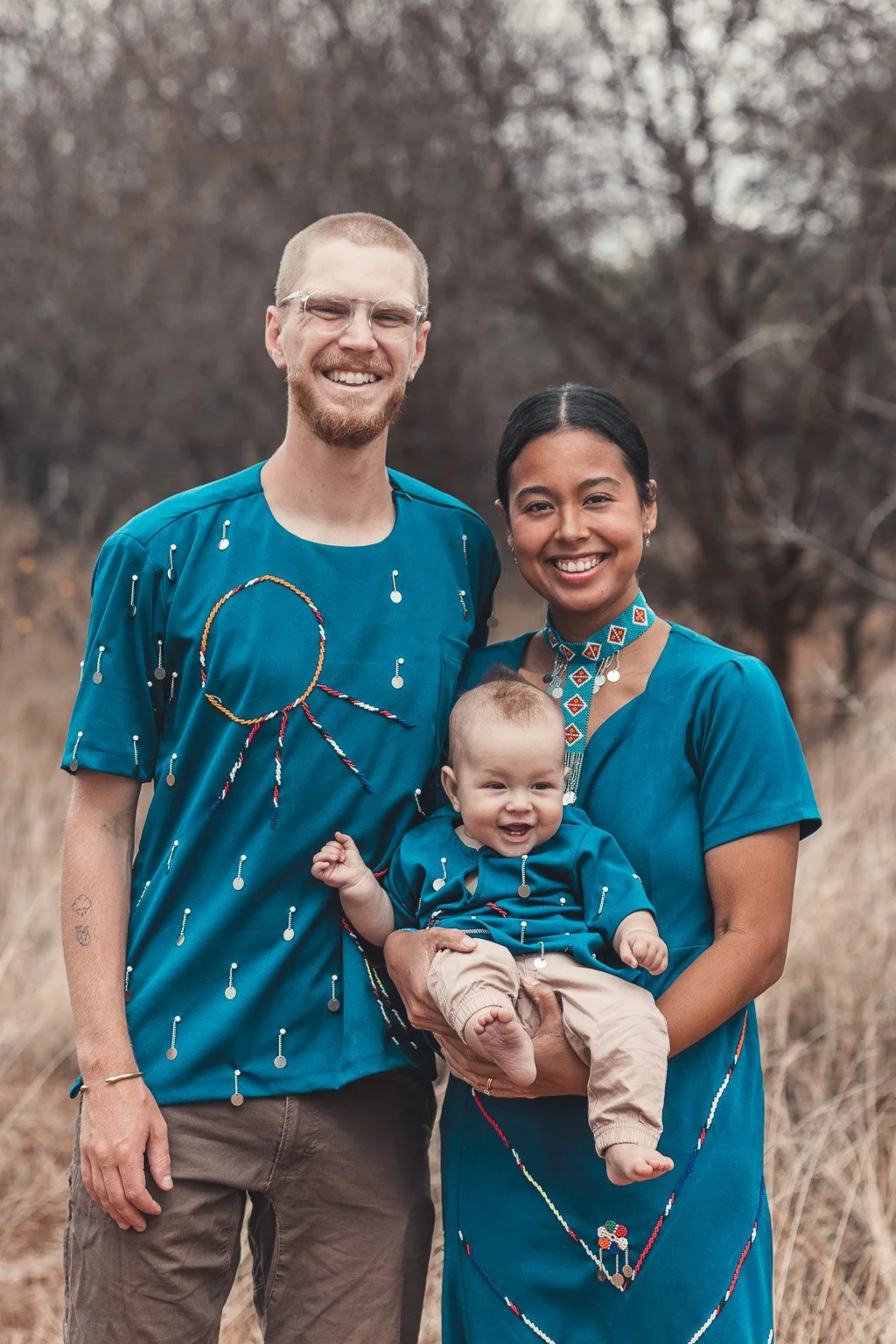 Todd and Emeris Rhines, the Kijani Farm Storytellers, are pictured with their young son.