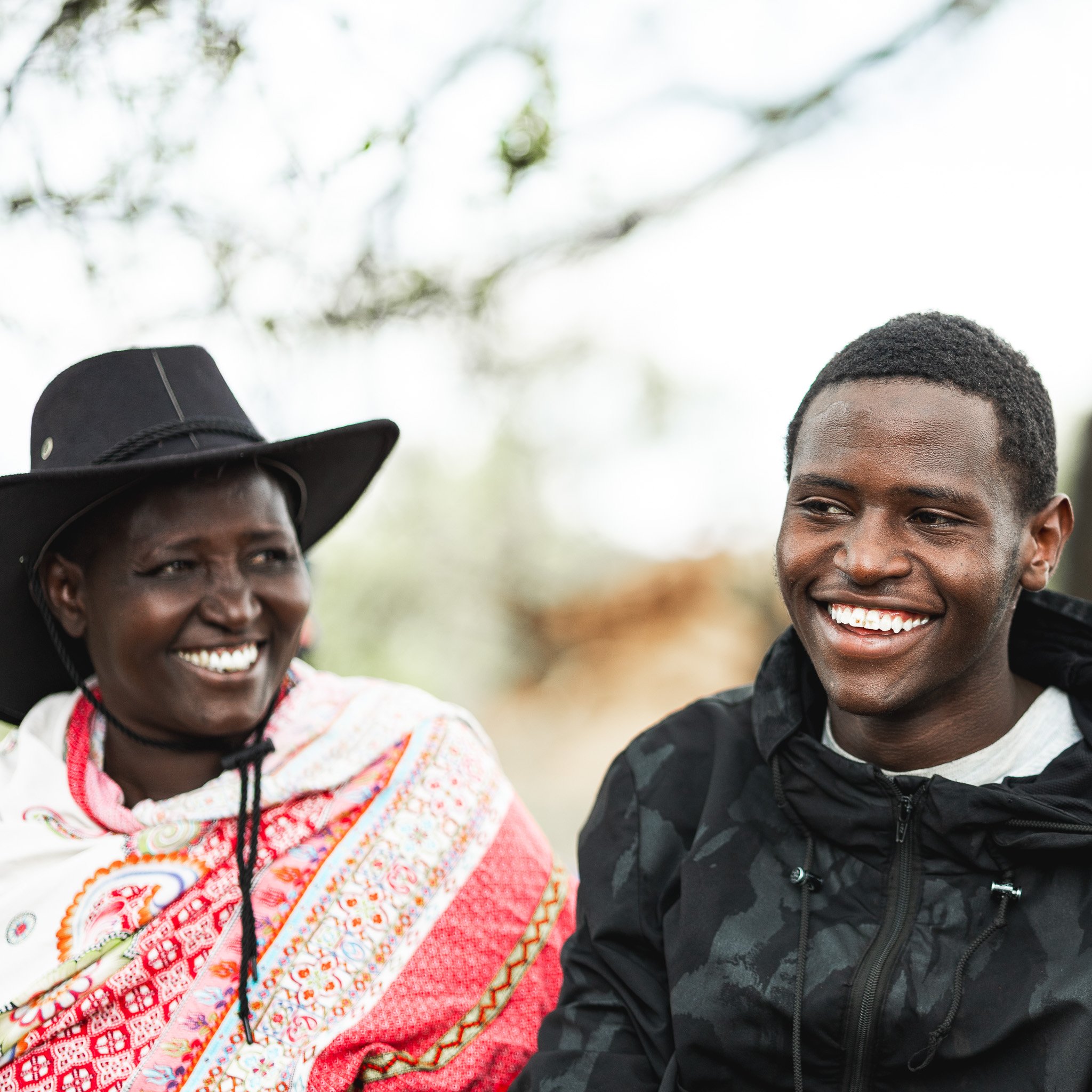 Mother and son smiling during a conversation