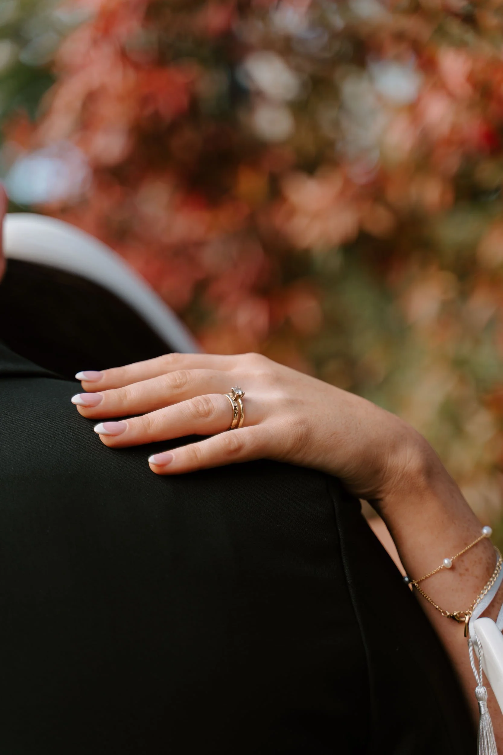 Wedding ring detail on shoulder close up natural light