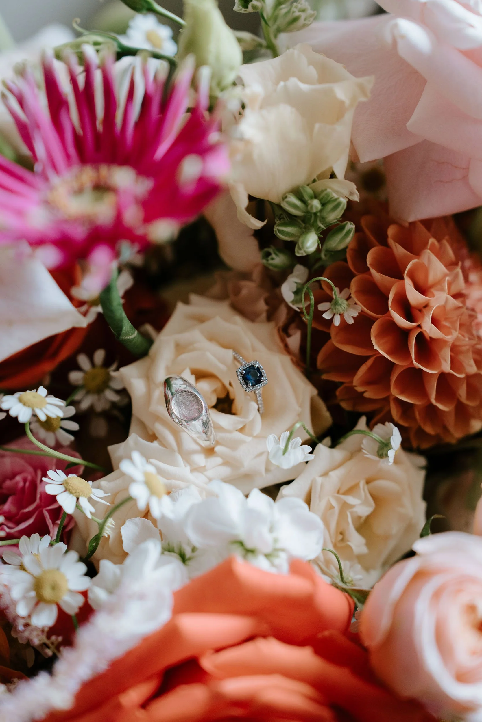 Wedding flowers and rings detail bridal bouquet close up