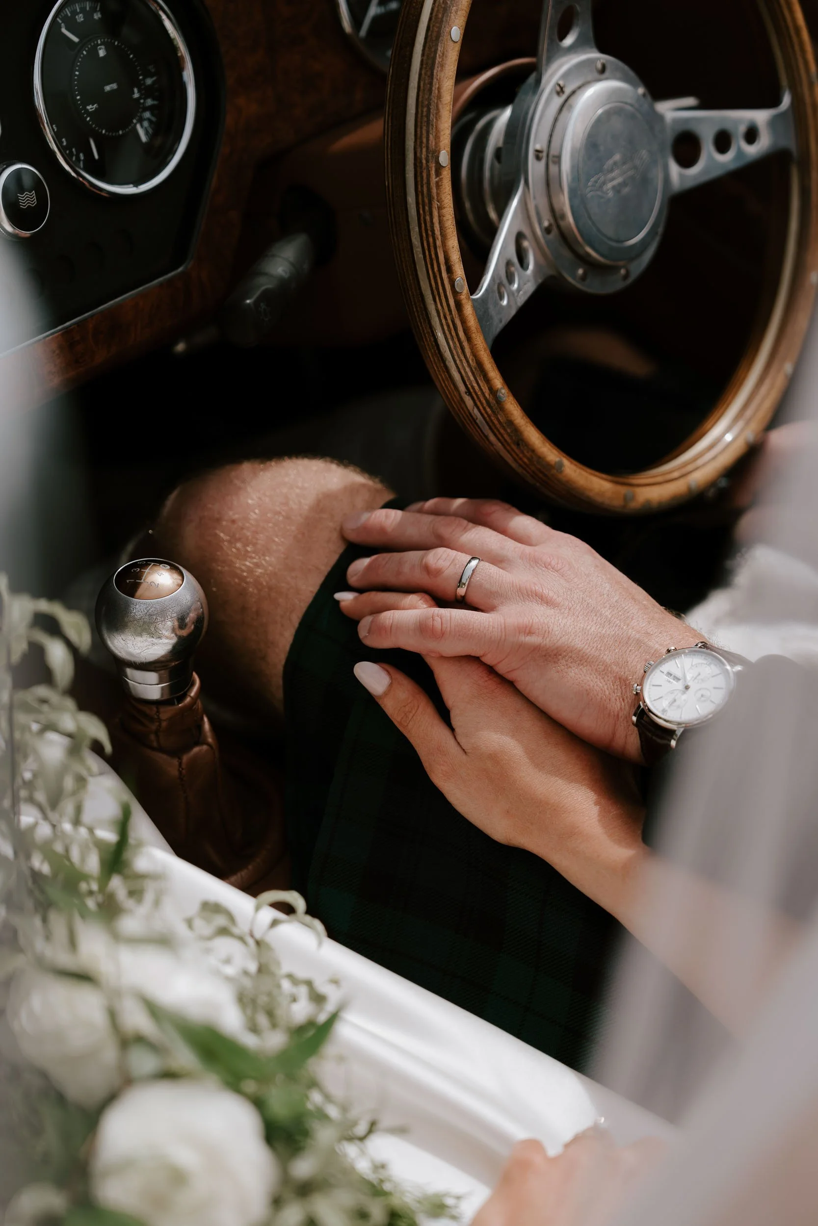 Intimate wedding moment showing couple’s hands and rings during ceremony