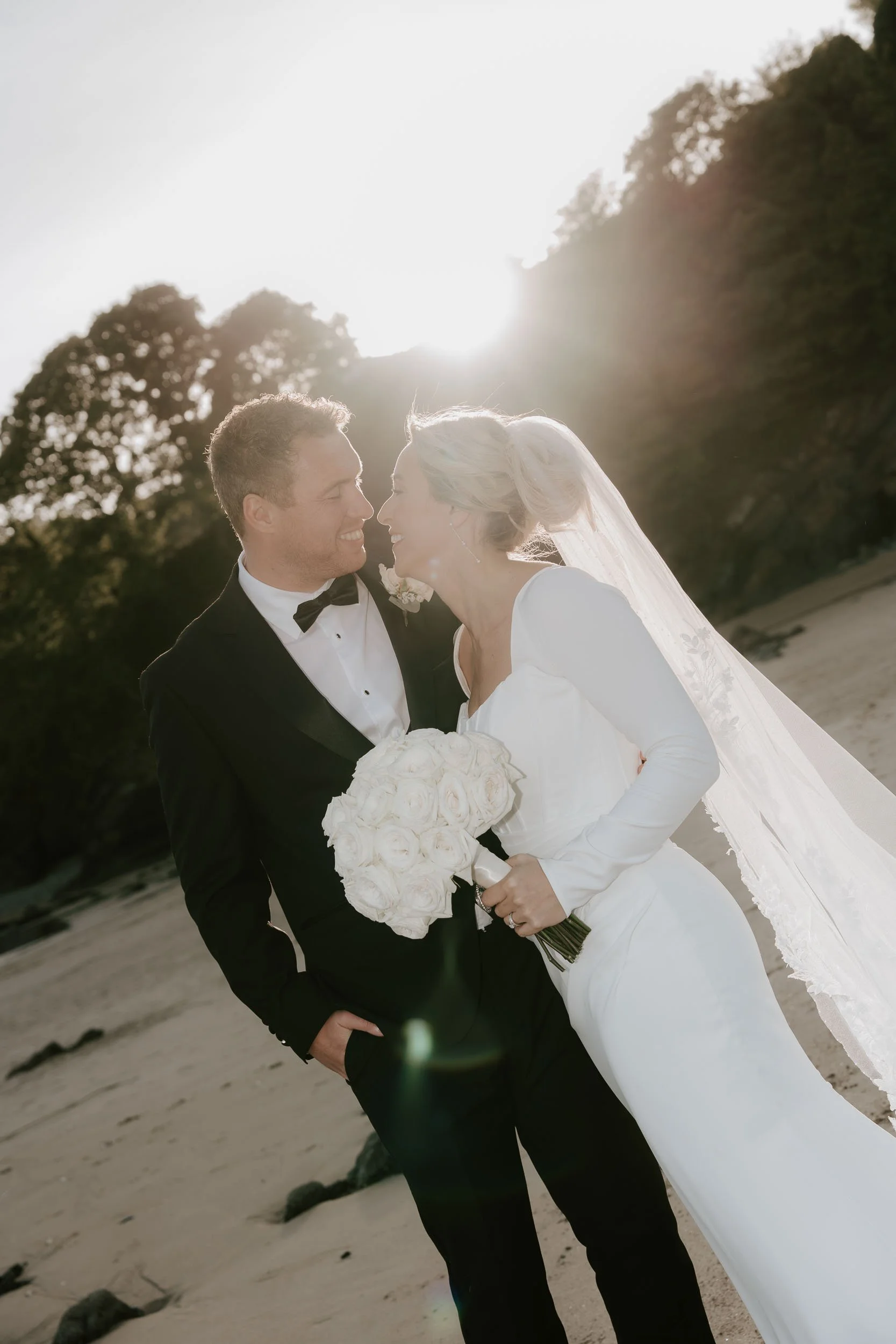 Coastal wedding photography Pembrokeshire natural couple moment by the sea
