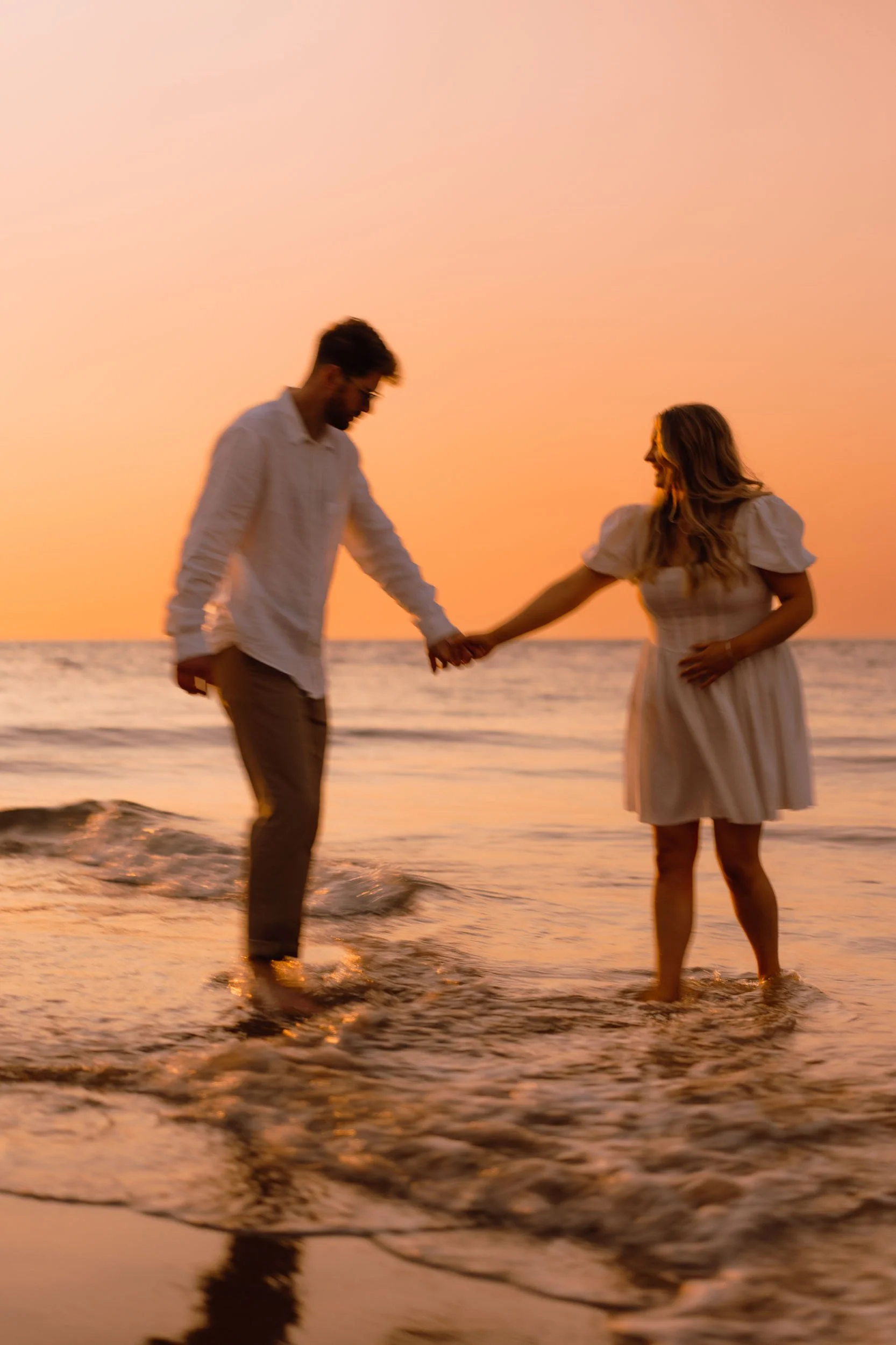 Couple engagement photo on Pembrokeshire coast natural light romantic moment