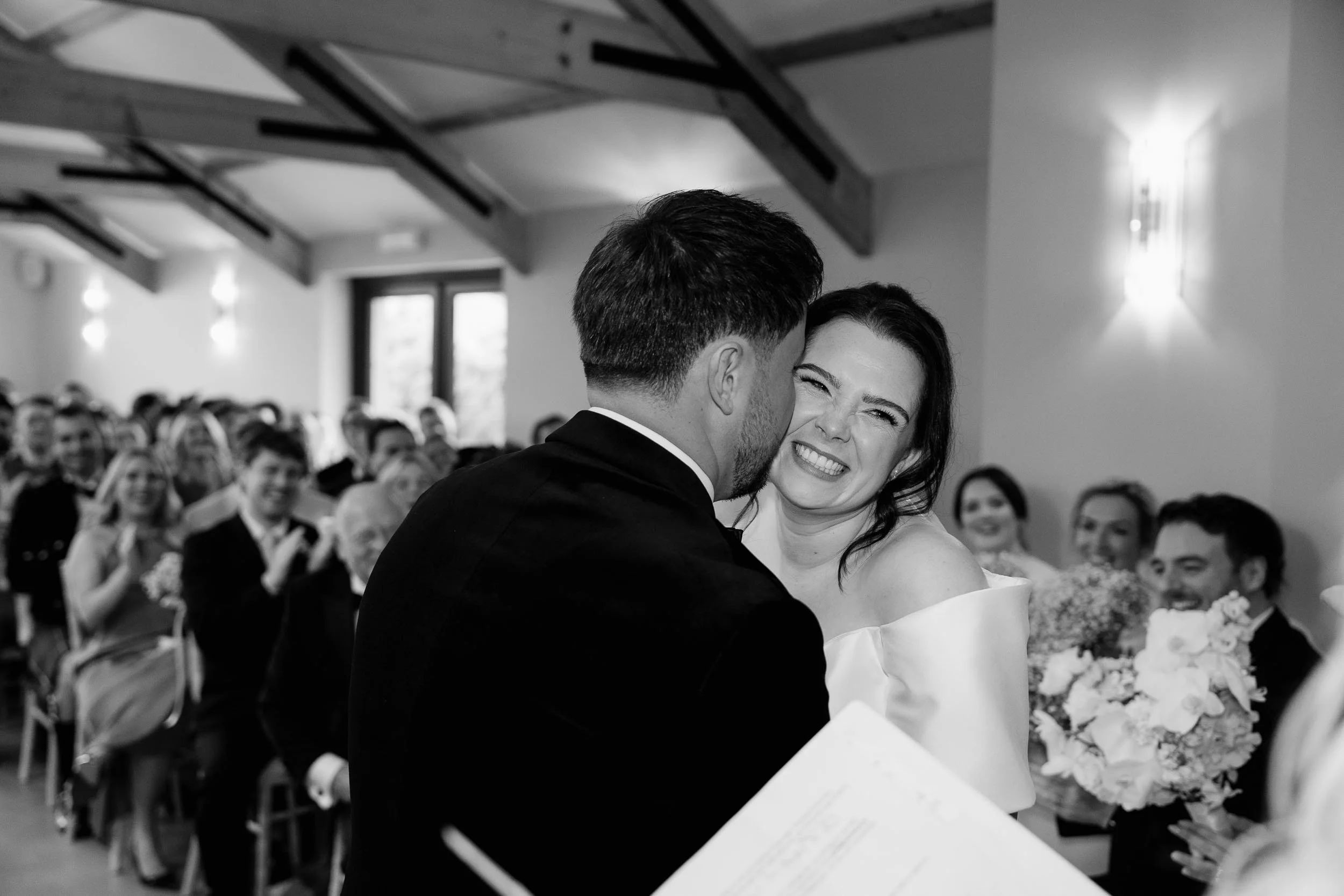 Unposed wedding photography couple laughing at Gellifawr