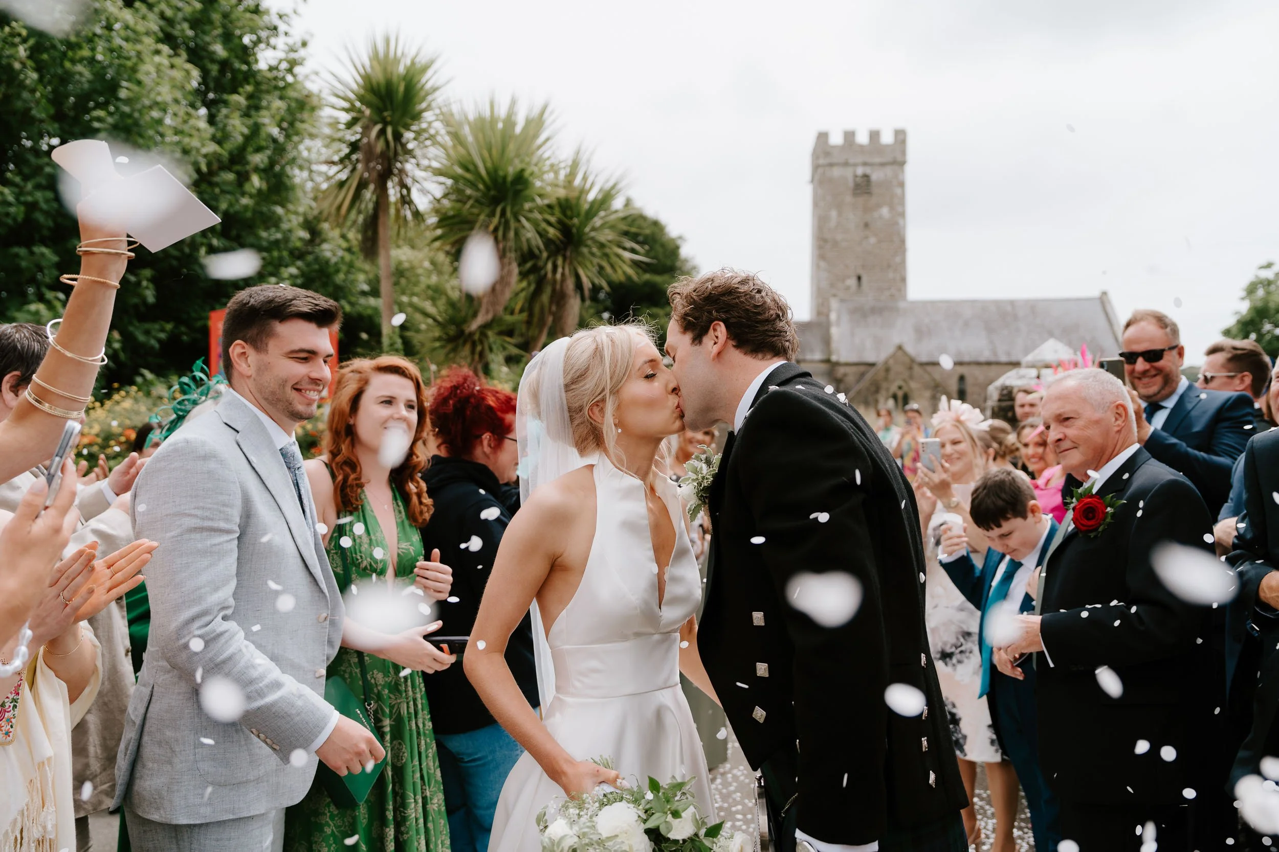 Bride and groom confetti moment at Pembrokeshire wedding