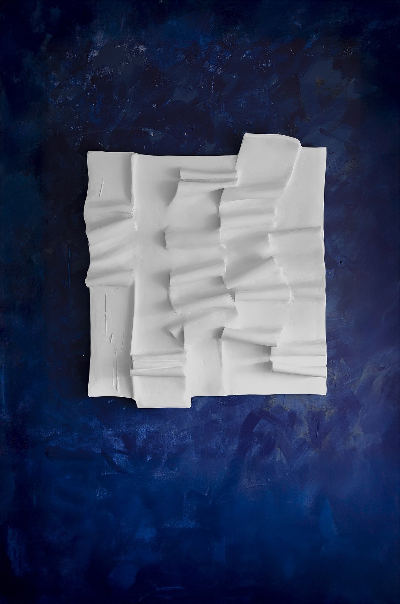 The Pulse by Anastasia Budieva (Budini) contemporary wall sculpture on deep blue backdrop