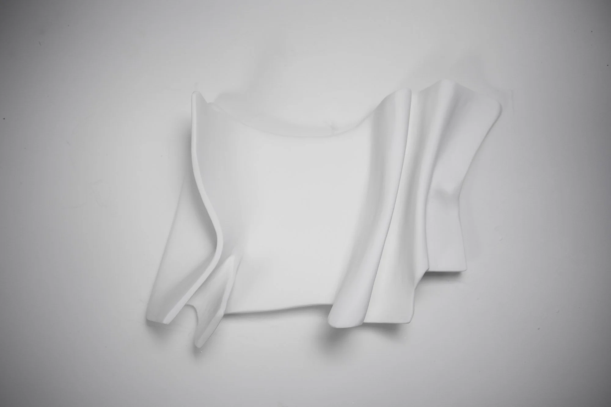 In Yang Series II by Budini — square textured wall sculpture, 62×62 cm in fabric and plaster, above-bed statement art