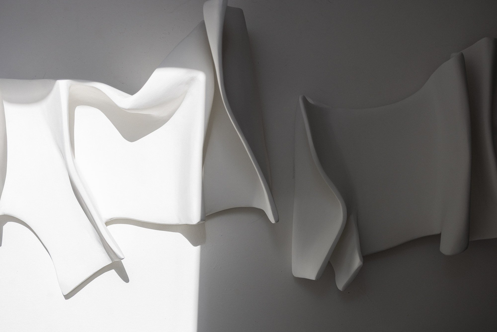 In Yang Series I and Series II displayed as a diptych - paired textured wall sculptures by Budini